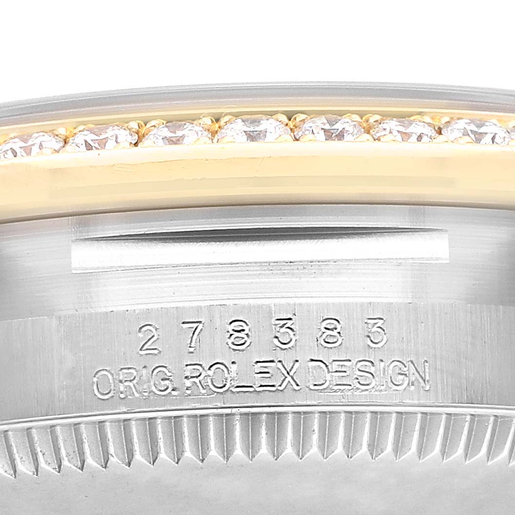 The image shows a close-up of the bezel with diamonds and engraved serial numbers of the Rolex Datejust 278383 Women's Steel and Gold (two tone) Green Dial.
