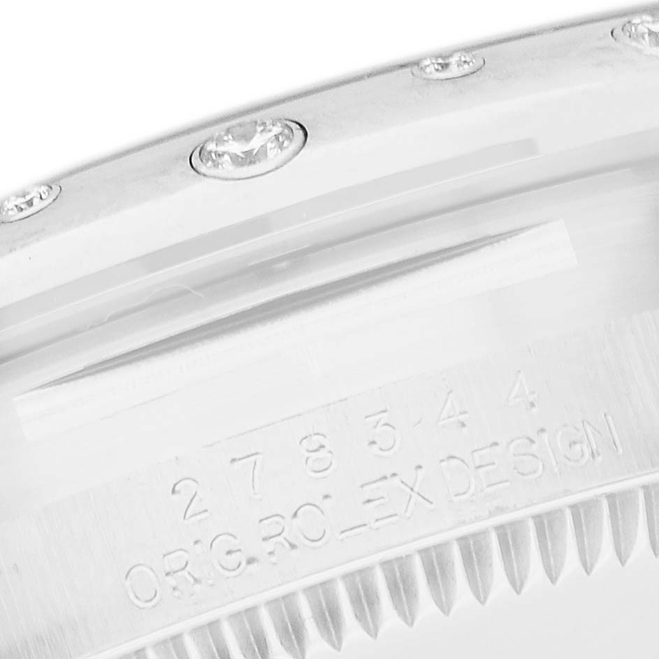 The image shows a close-up of the bezel and case edge of a Rolex Datejust 278344 Women
s Stainless Steel Grey Dial 278344 Women
s Stainless Steel Grey Dial watch, highlighting the diamond details and engraving.