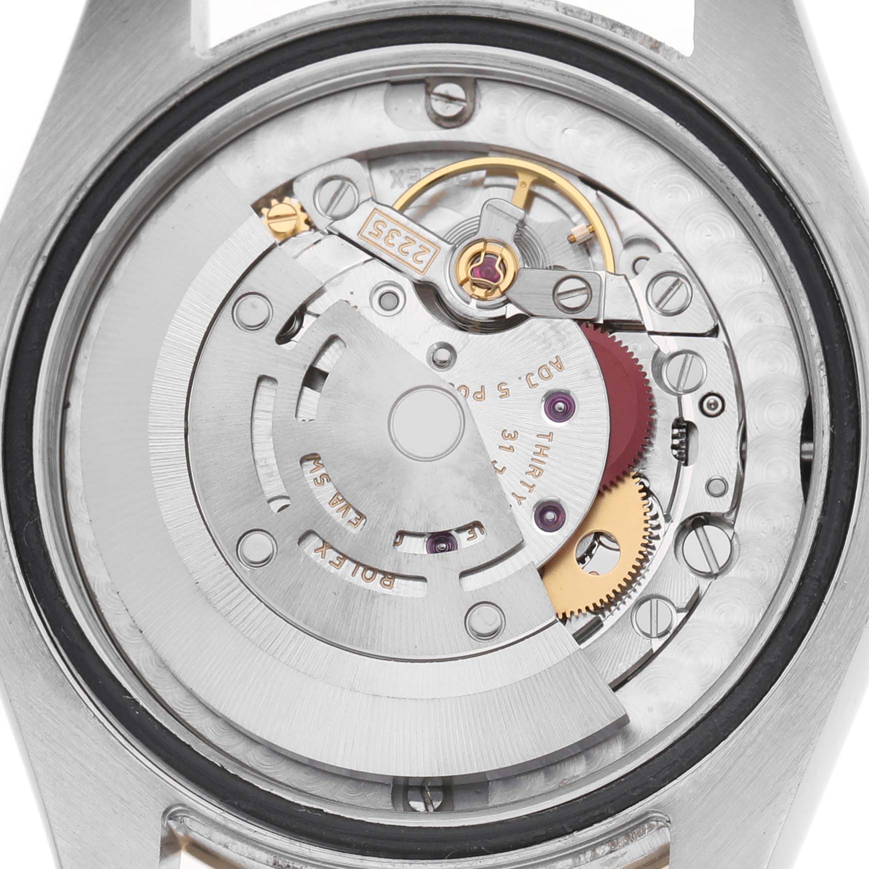 The image shows the movement of a Rolex Datejust 178273 Women's Stainless Steel Black Dial watch with a focus on its inner mechanics from a top-down angle.