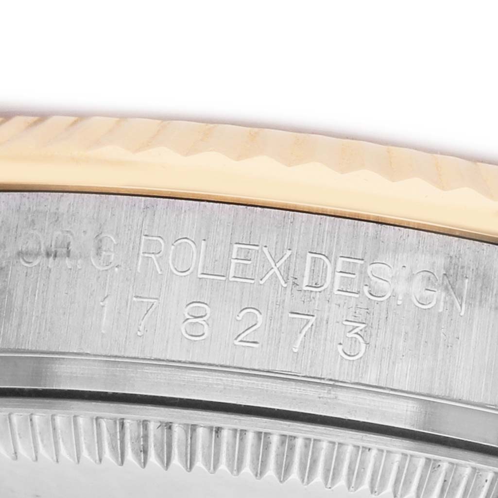 The image shows a close-up of the case side with engravings on the Rolex Datejust 178273 Women's Stainless Steel Black Dial model.