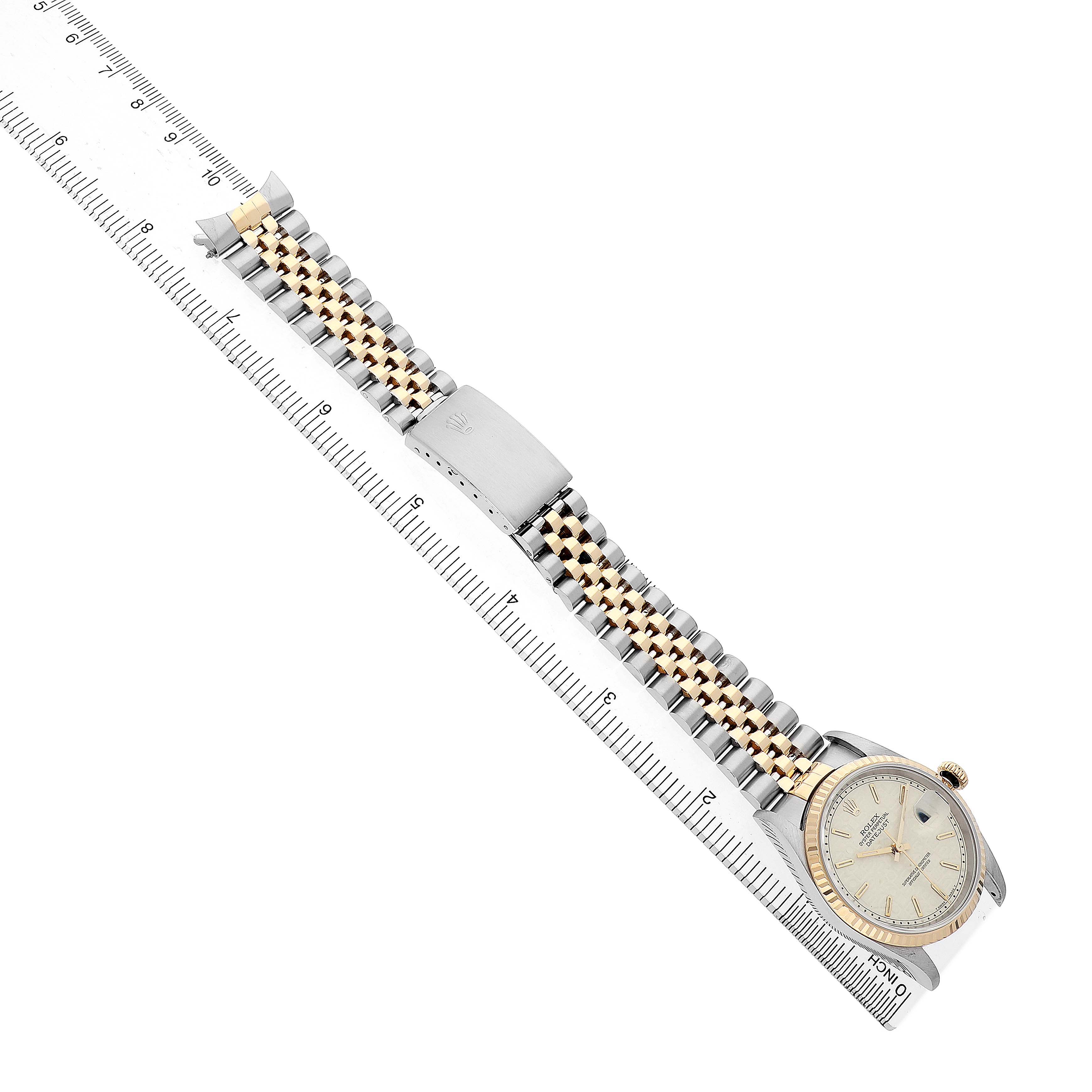 The Rolex Datejust 16233 Men's Stainless Steel White Dial watch is shown from a top view, featuring the face, bracelet, and clasp.