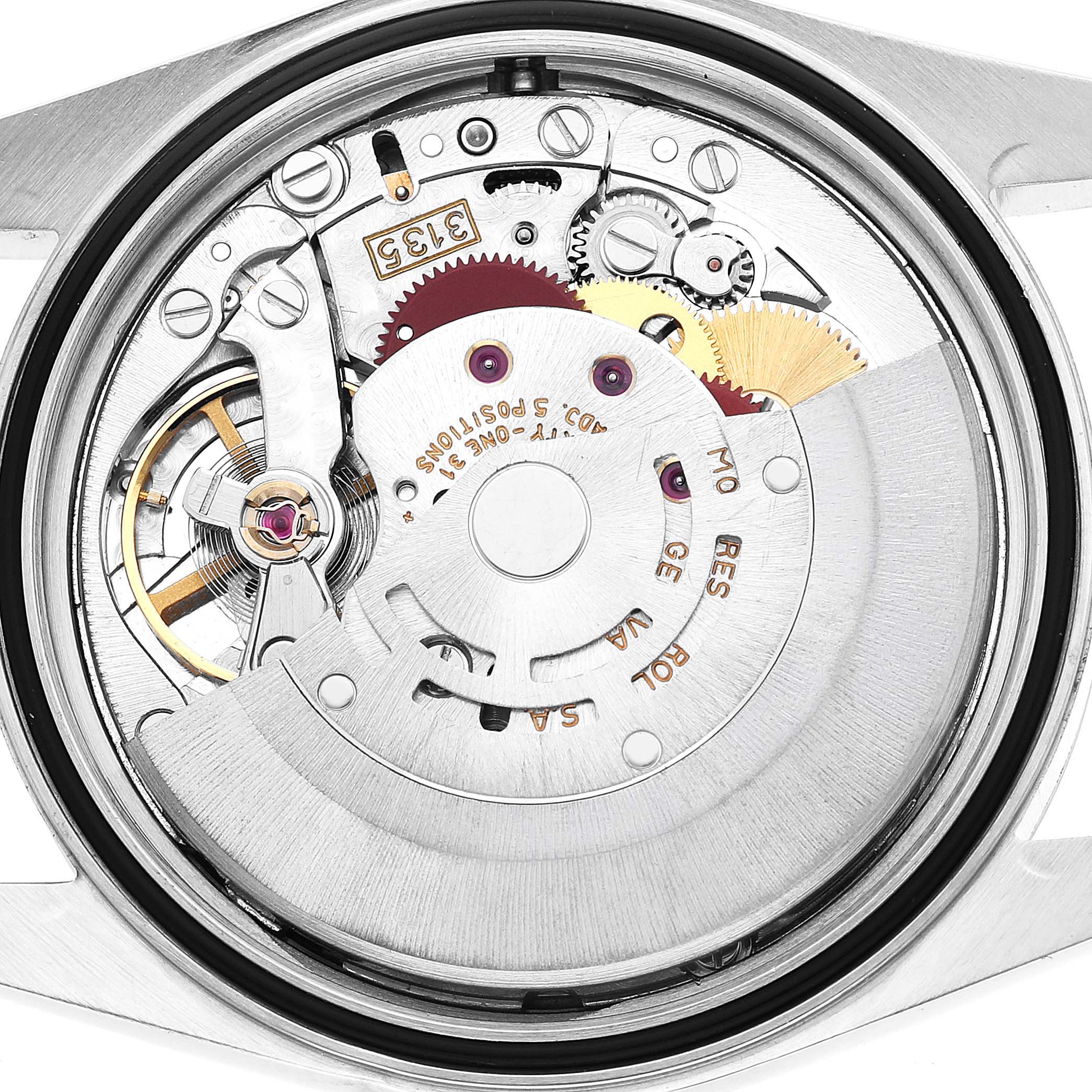 This image shows the Rolex Datejust 16233 Men's Stainless Steel White Dial movement from a rear view, revealing intricate gears and components.