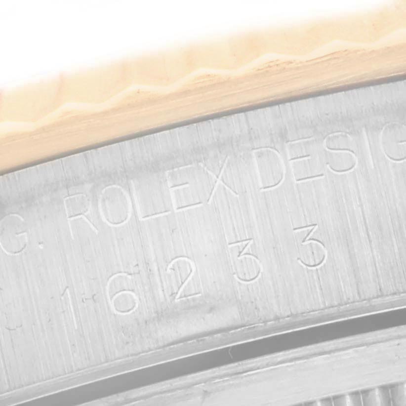 The image shows a close-up angle of the Rolex Datejust 16233 Men
s Steel and Gold (two tone) Champagne Dial 16233 Men
s Steel and Gold (two tone) Champagne Dial
s engraved inner bezel with the model number.