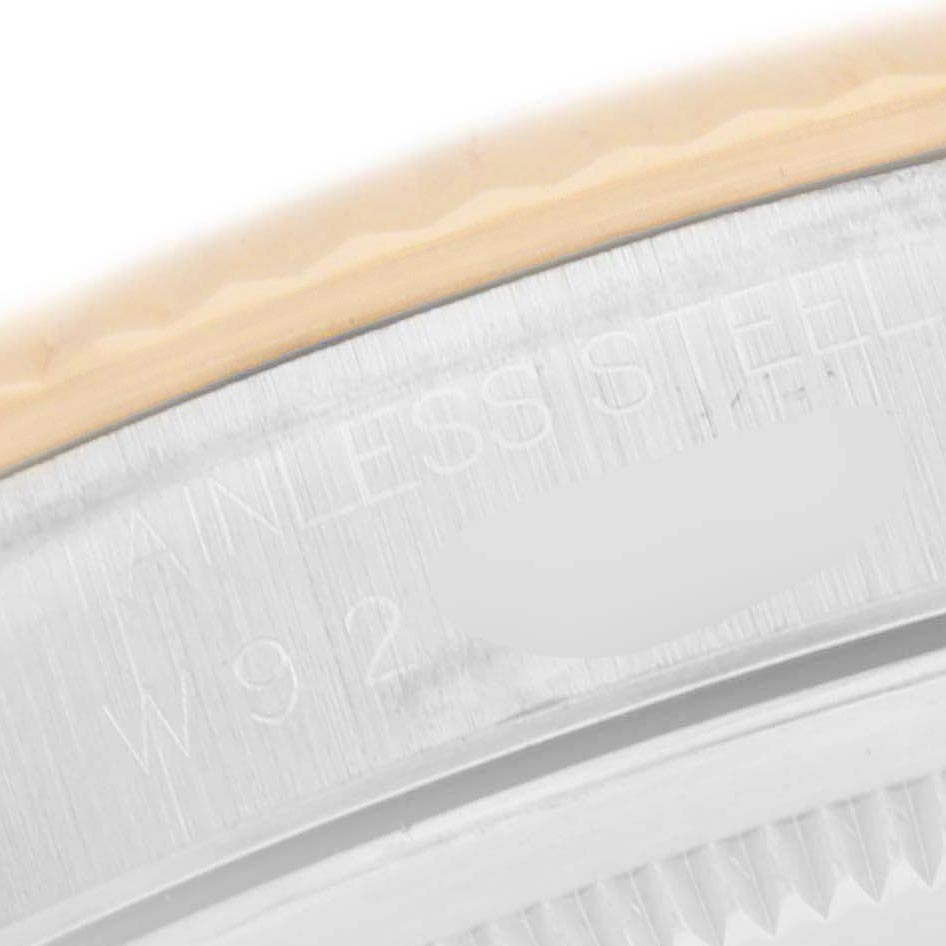 The image focuses on the steel edge of a Rolex Datejust 16233 Men
s Steel and Gold (two tone) Champagne Dial 16233 Men
s Steel and Gold (two tone) Champagne Dial, highlighting the engraved "STAINLESS STEEL" text.