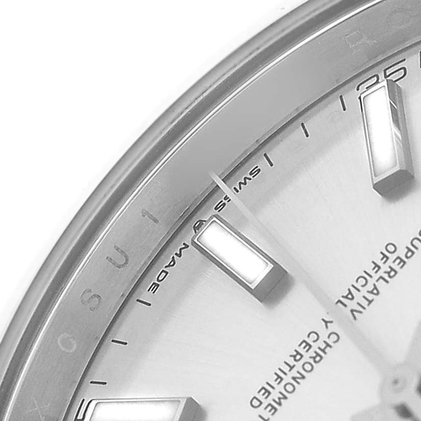 The image shows a close-up of the Rolex Datejust 41 126300 Men's Stainless Steel Silver Dial's dial, focusing on the hour markers and part of the rehaut.