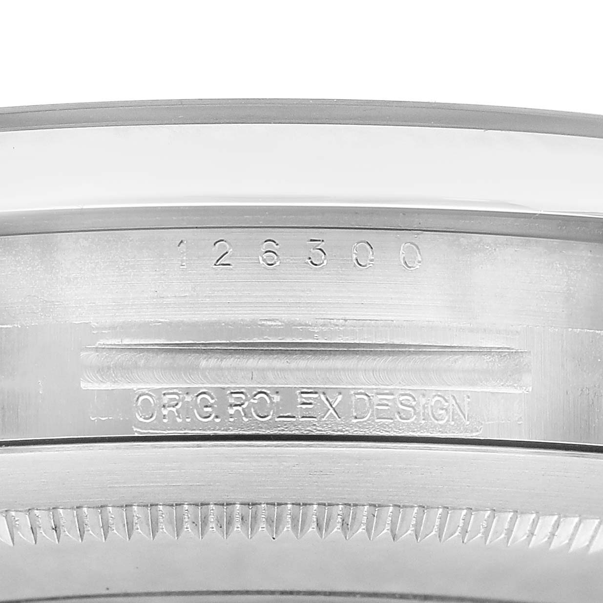 The image shows a close-up of the inner case engraving on a Rolex Datejust 41 126300 Men's Stainless Steel Silver Dial, highlighting the model number and design details.