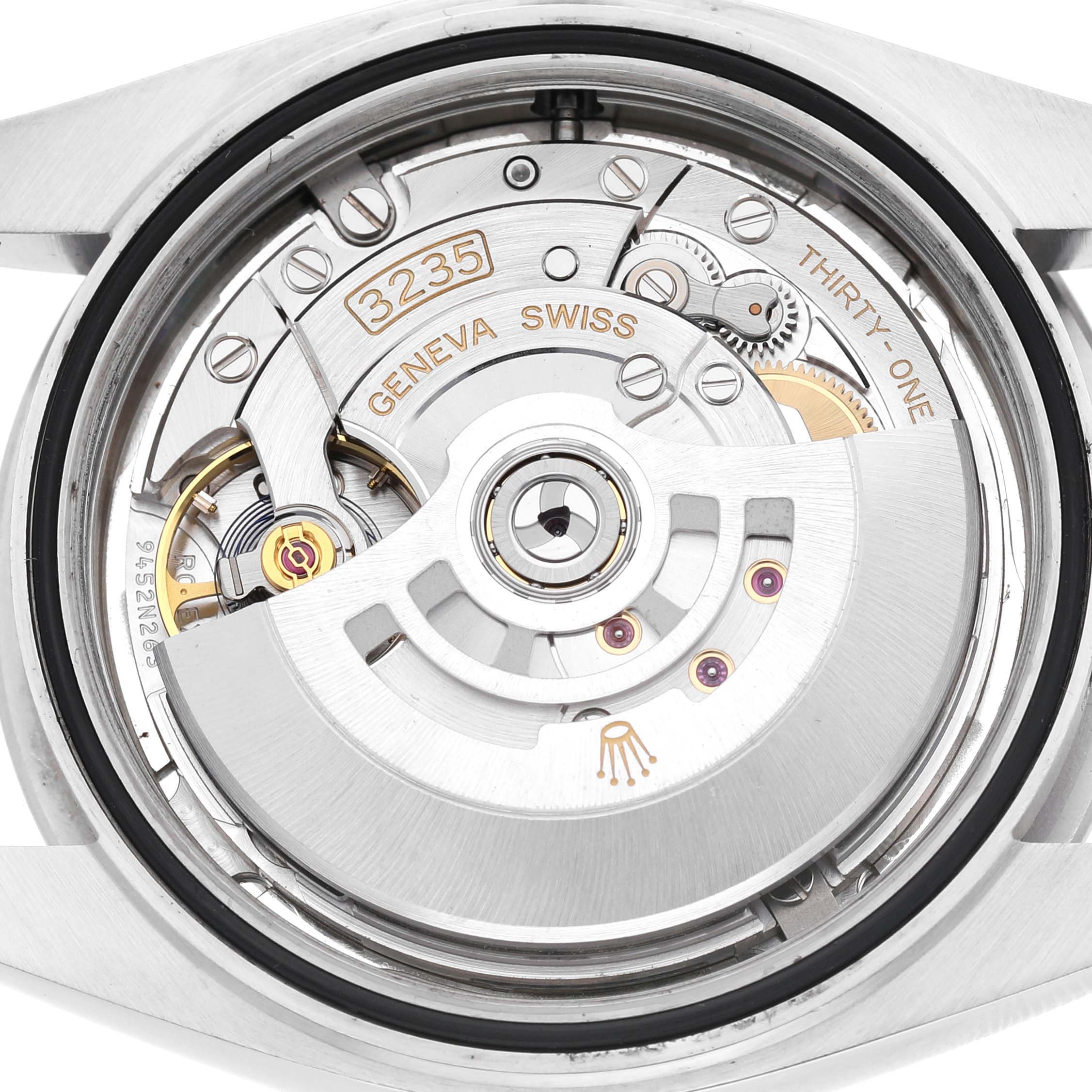 The image shows the movement of a Rolex Datejust 41 126300 Men's Stainless Steel Silver Dial, viewed from the back, highlighting internal components.