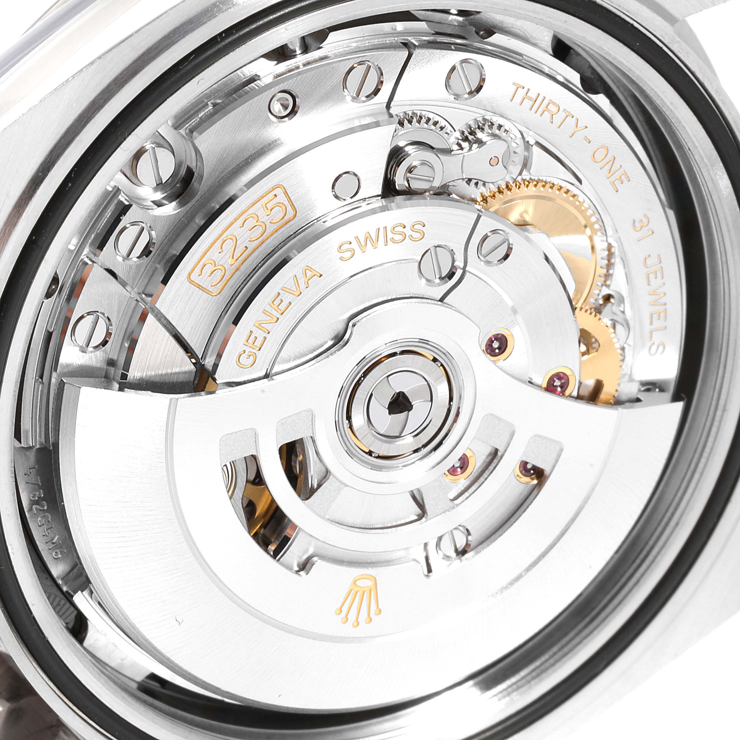 The image shows a close-up view of the movement mechanism of a Rolex Datejust 126334 Men
s Stainless Steel Black Dial 126334 Men
s Stainless Steel Black Dial watch.