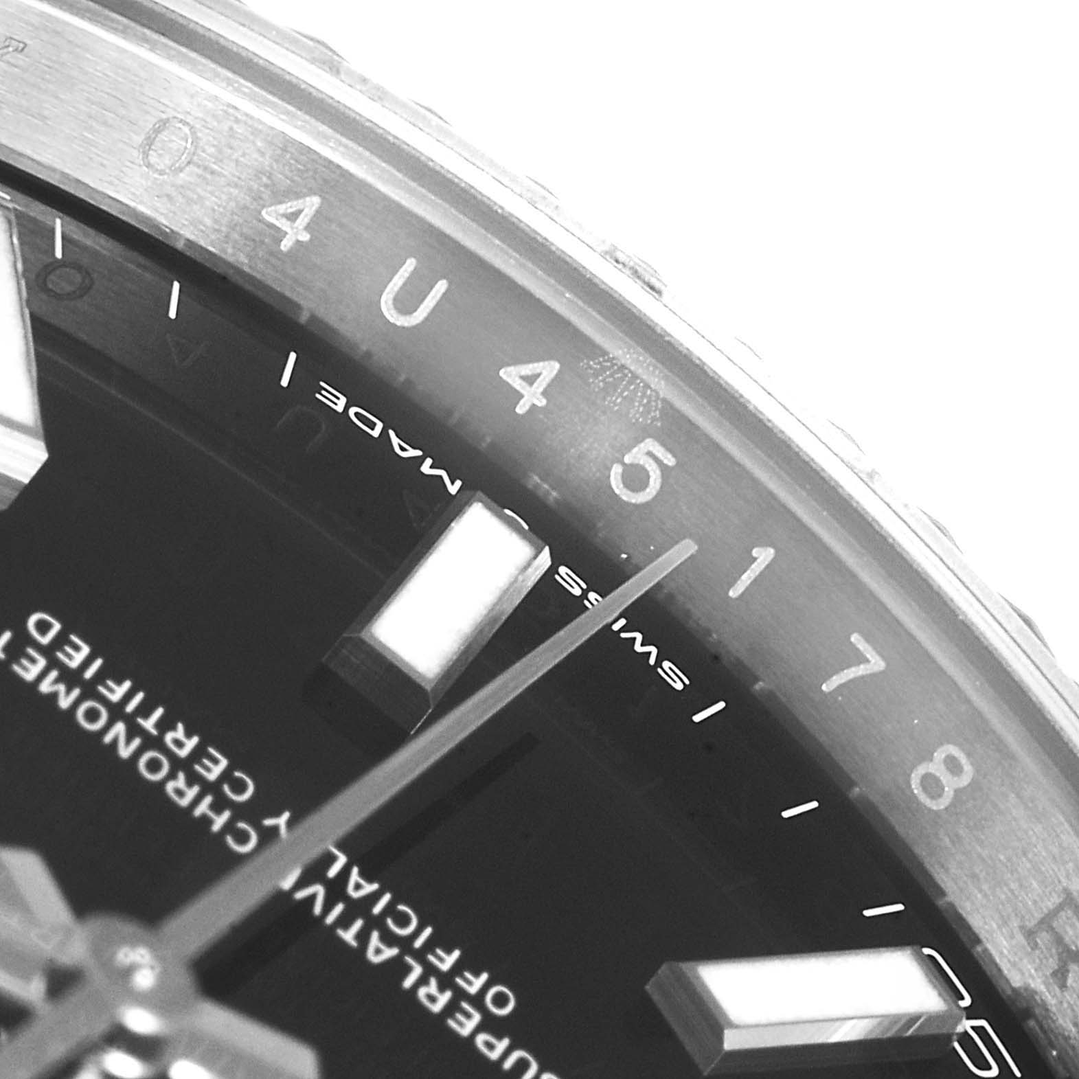 Close-up angle showing the dial and bezel of the Rolex Datejust 126334 Men
s Stainless Steel Black Dial 126334 Men
s Stainless Steel Black Dial watch, featuring hour markers and the "Swiss Made" label.