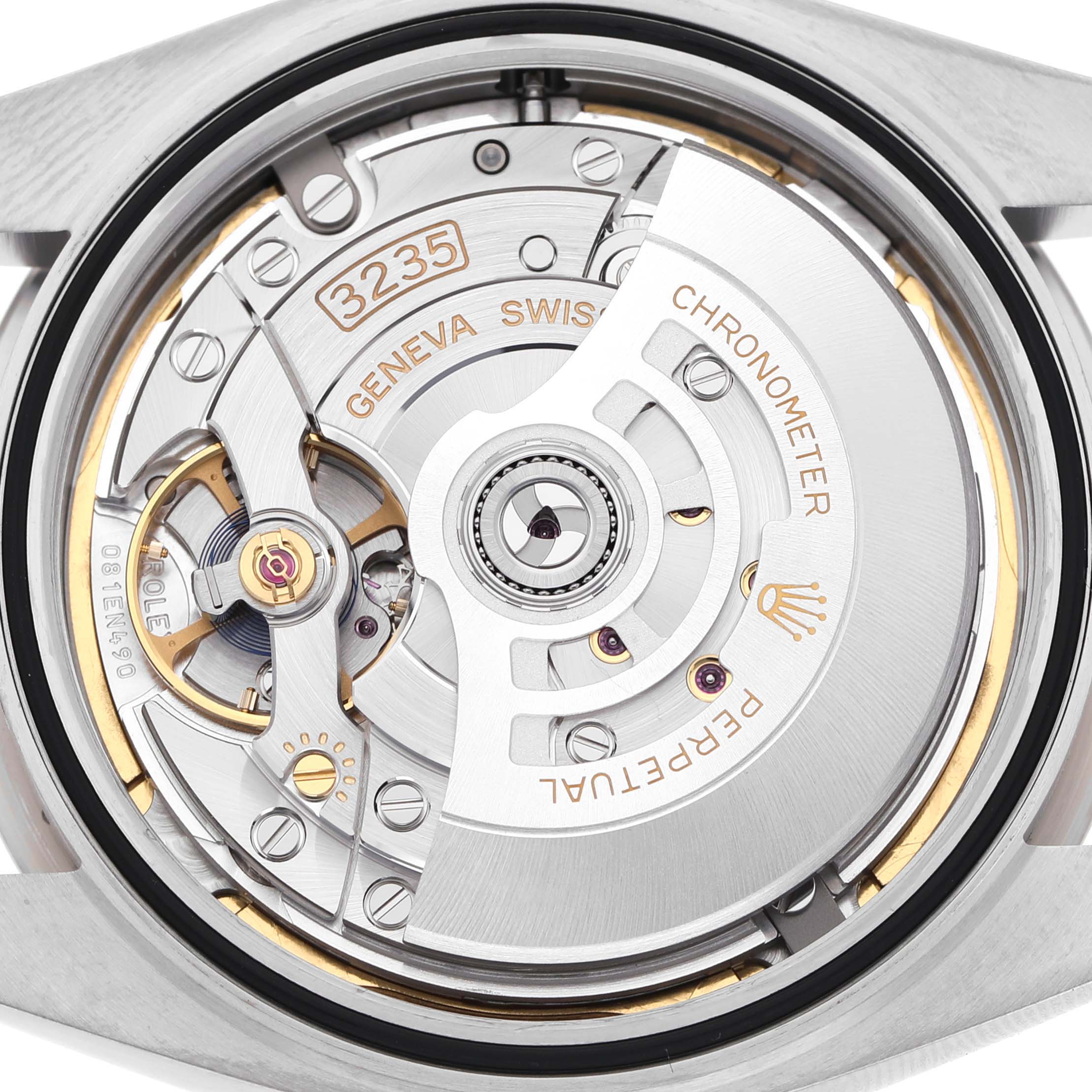 The image shows the case back and movement of a Rolex Datejust 41 126334 Men's Stainless Steel Grey Dial, highlighting the intricate mechanics.