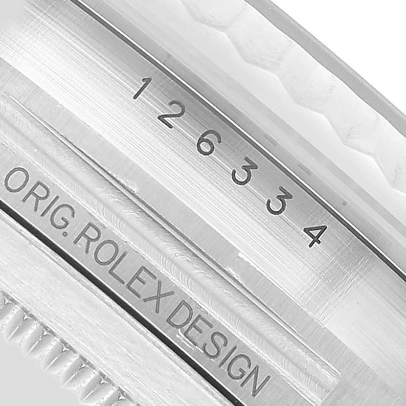 The image shows a close-up of the side view of a Rolex Datejust 41 126334 Men's Stainless Steel Grey Dial, featuring model and design engravings.