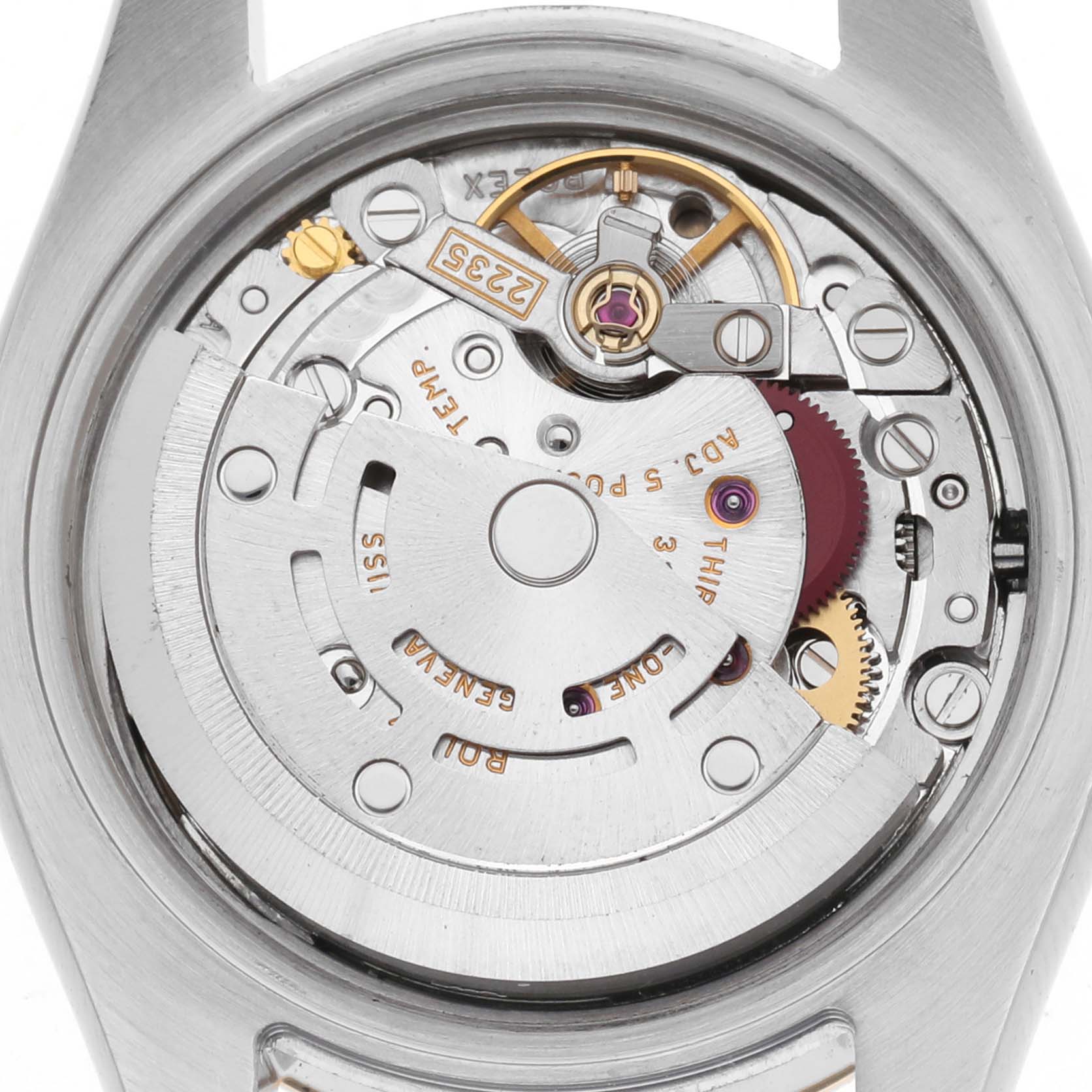 The image shows the movement of a Rolex Datejust 179173 Women
s Steel and Gold (two tone) Champagne Dial 179173 Women
s Steel and Gold (two tone) Champagne Dial watch, viewed from the back, displaying the rotor and intricate gears.