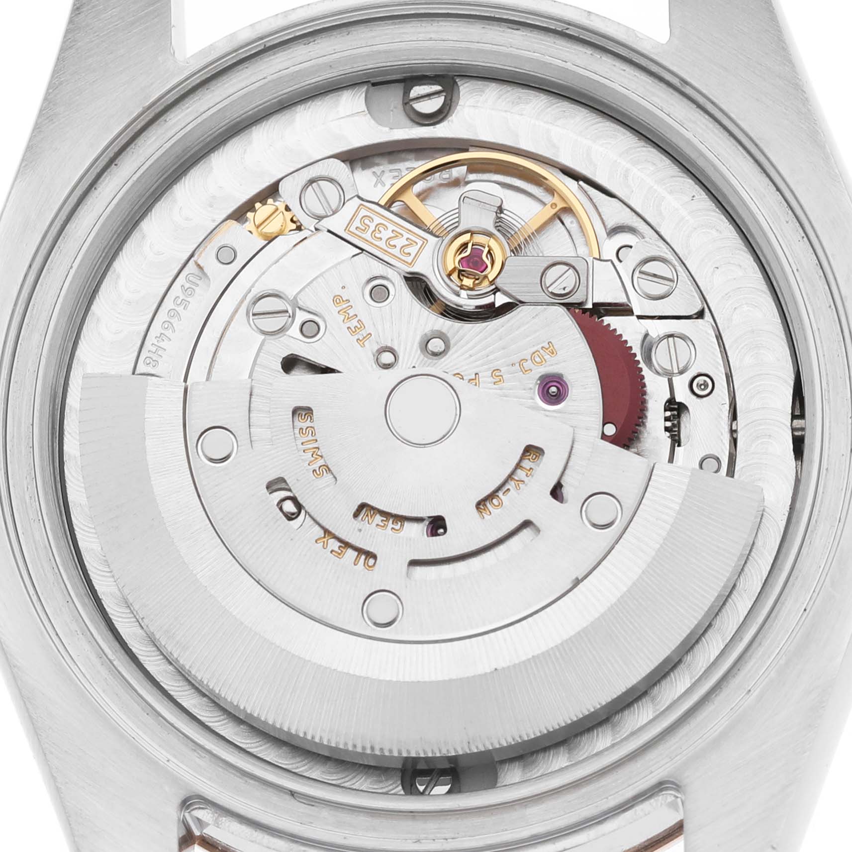 This image shows the movement of a Rolex Mid-Size 178271 Women's Stainless Steel Silver Dial watch, featuring gears and the rotor mechanism.