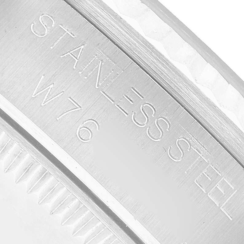 The image shows a close-up of the engraved edge on a stainless steel case of a Rolex Mid-Size 68274 Women's Stainless Steel Pink Dial model.