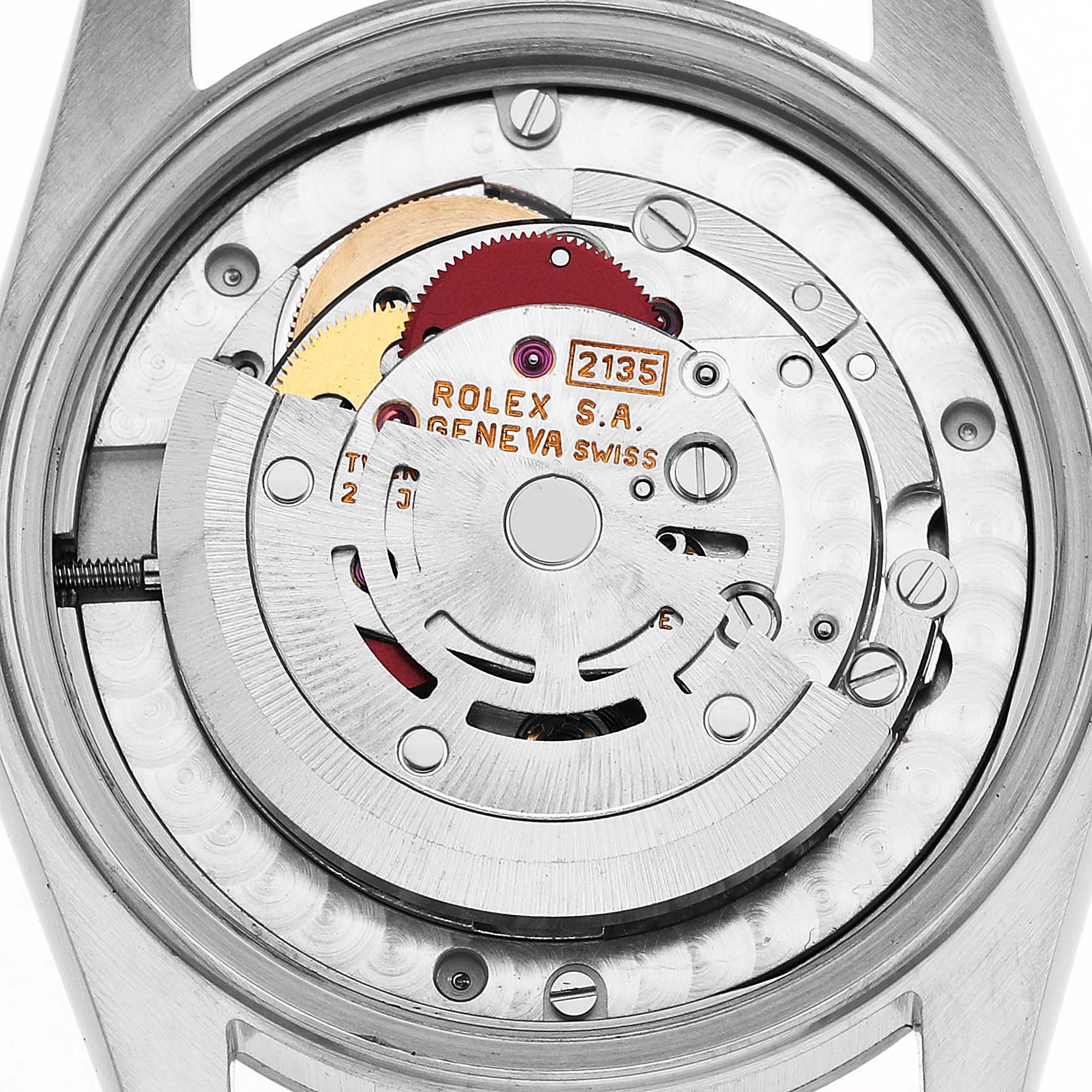 The image shows the movement of a Rolex Mid-Size 68274 Women's Stainless Steel Pink Dial watch from the back, highlighting the rotor and gears.