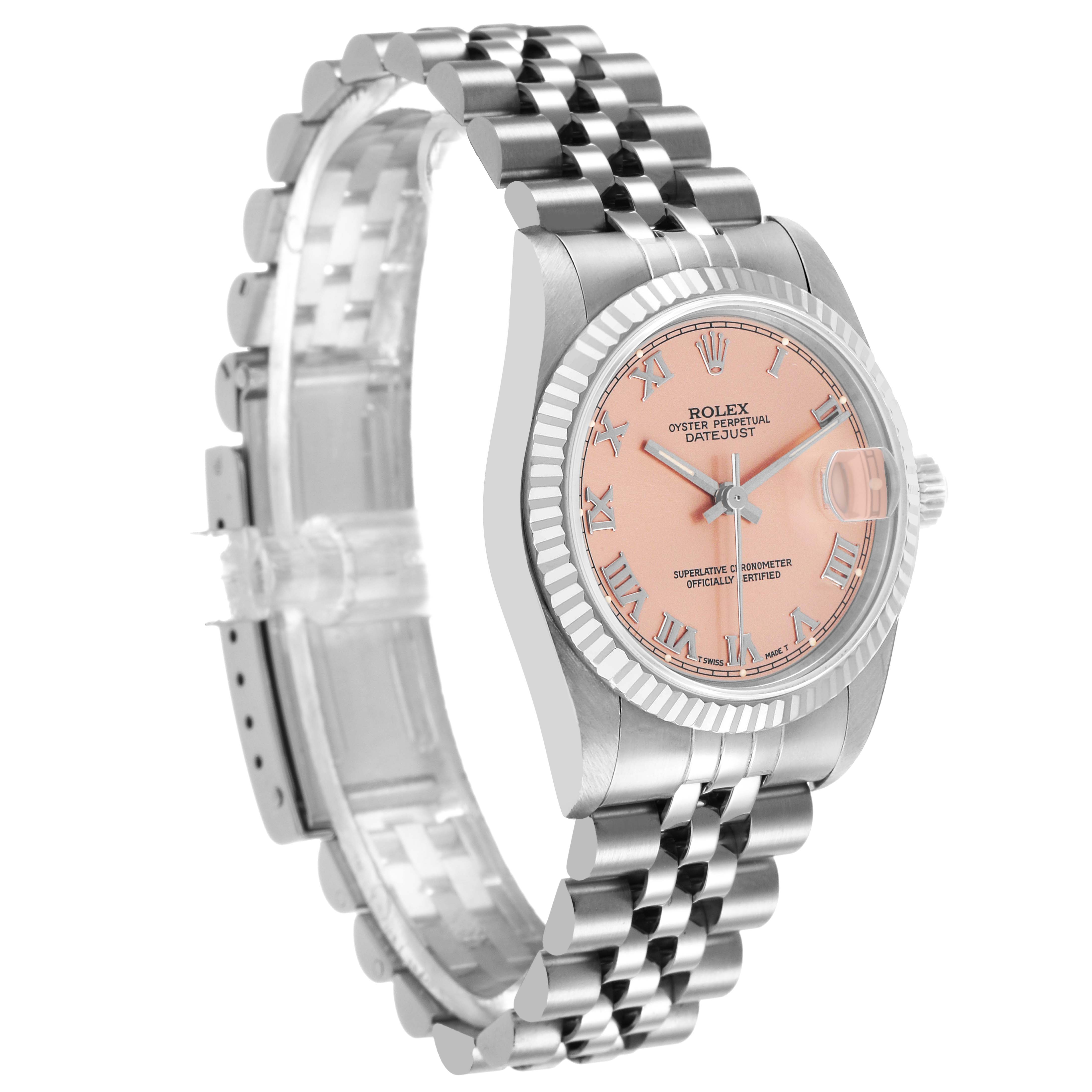 The Rolex Mid-Size 68274 Women's Stainless Steel Pink Dial watch is shown at a three-quarter angle, highlighting its pink dial, fluted bezel, and Jubilee bracelet.