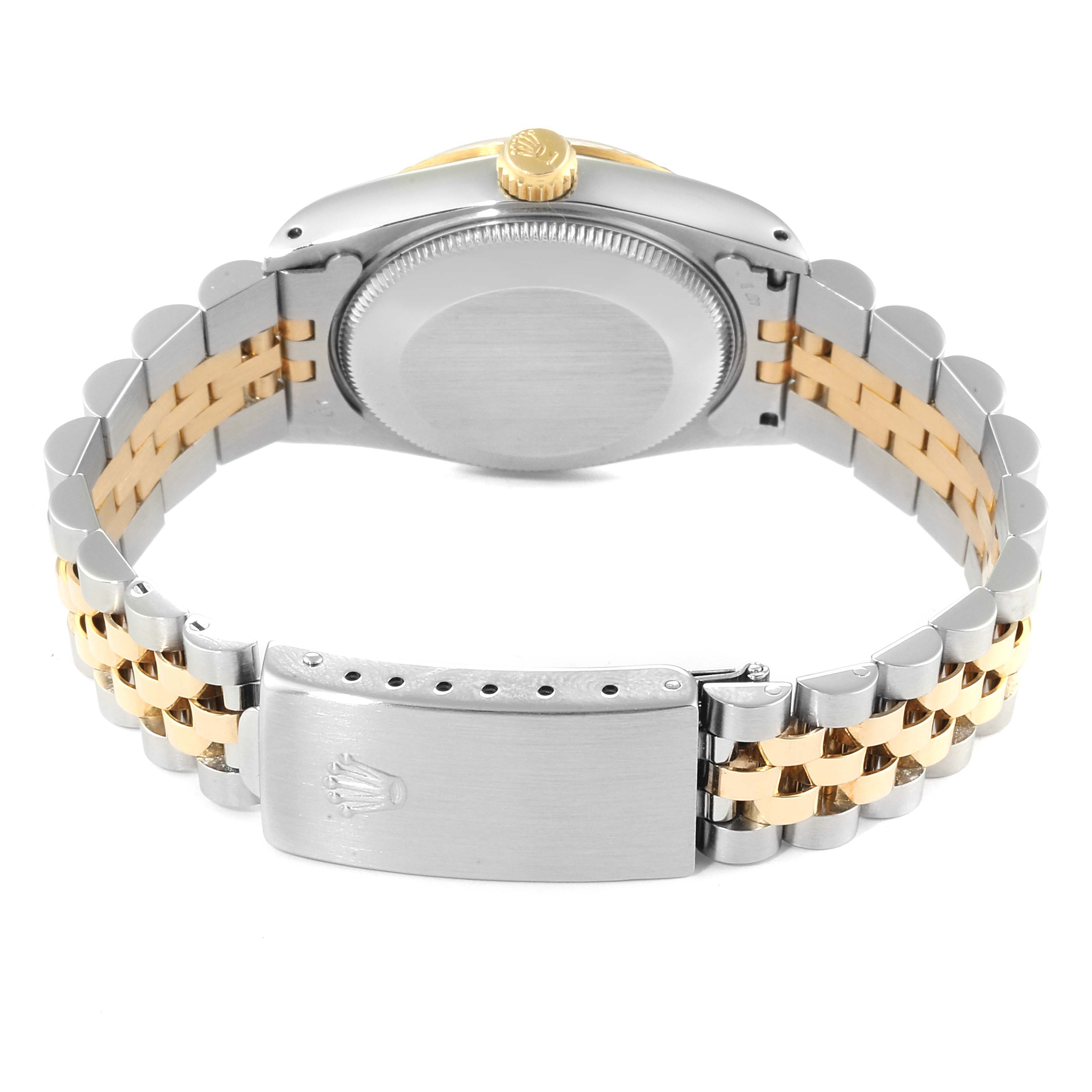 The image displays the back view of a Rolex Mid-Size 68273 Women
s Steel and Gold (two tone) Champagne Dial 68273 Women
s Steel and Gold (two tone) Champagne Dial model watch, showing its case back, crown, and two-tone bracelet with the clasp.