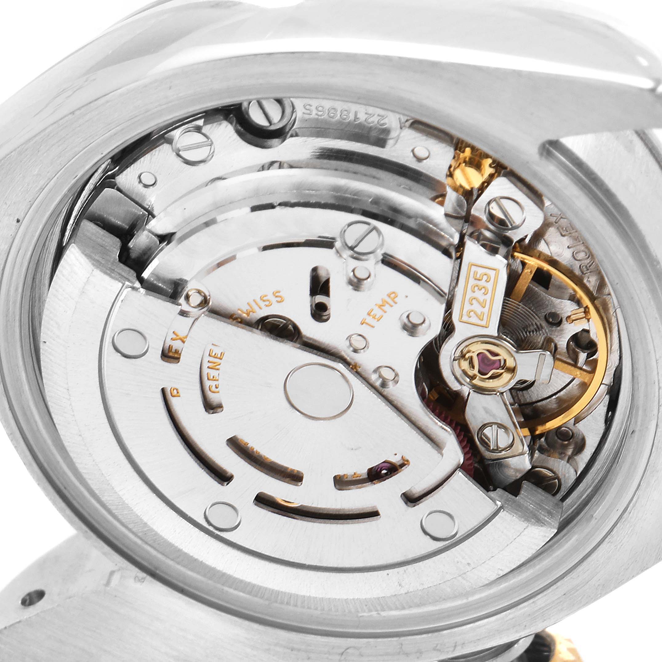 This is an angled view of the Rolex Datejust 179171 Women
s Steel and Gold (two tone) Silver Dial 179171 Women
s Steel and Gold (two tone) Silver Dial movement’s inner mechanism, showcasing components like the rotor and balance wheel.