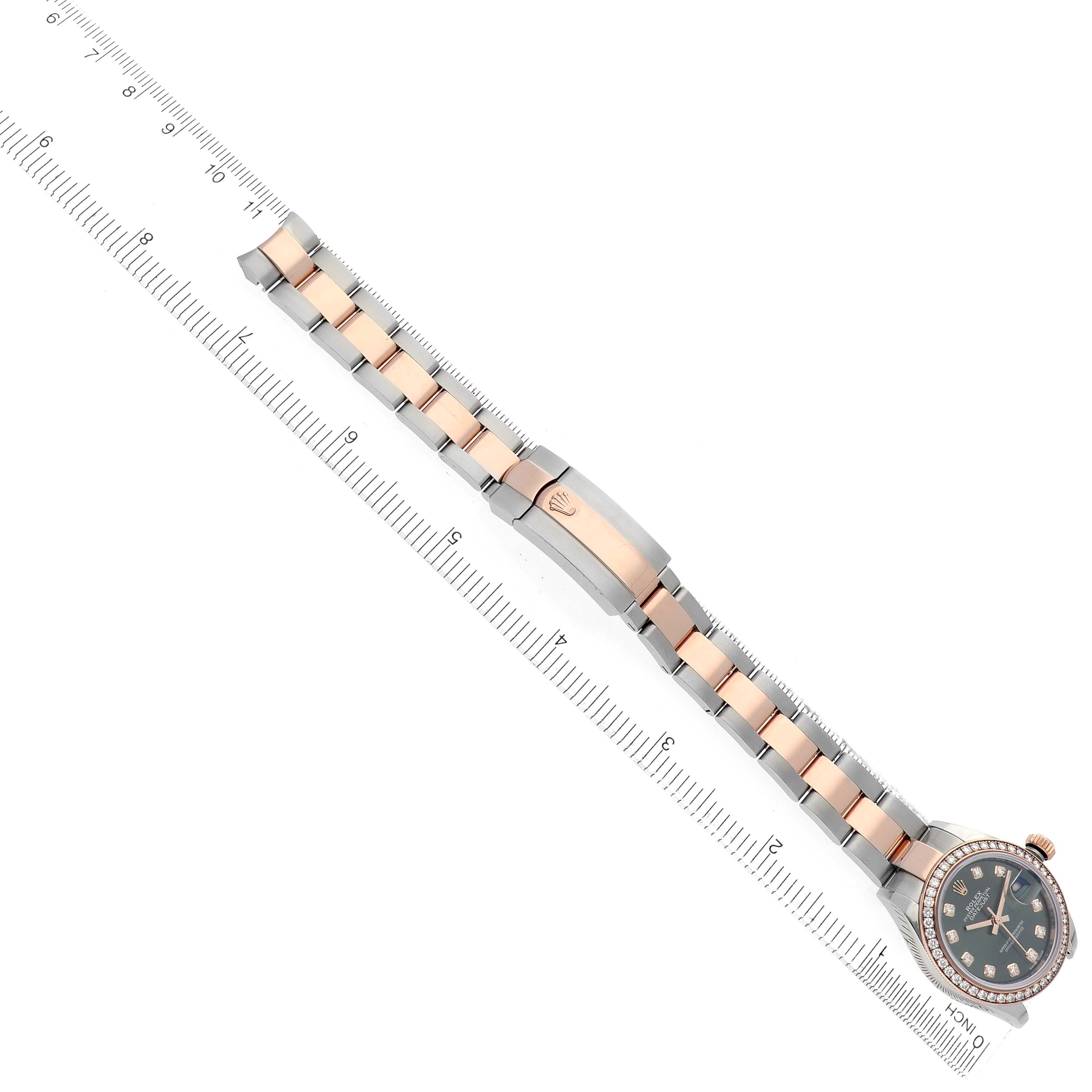 The Rolex Datejust 279381 Women's Steel and Gold (two tone) Green Dial 279381 Women's Steel and Gold (two tone) Green Dial watch is shown from a top-down angle, displaying its two-tone bracelet, clasp, and face.