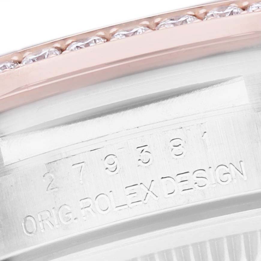 The image shows a close-up of the bezel and the engraved side of the Rolex Datejust 279381 Women's Steel and Gold (two tone) Green Dial 279381 Women's Steel and Gold (two tone) Green Dial watch case.