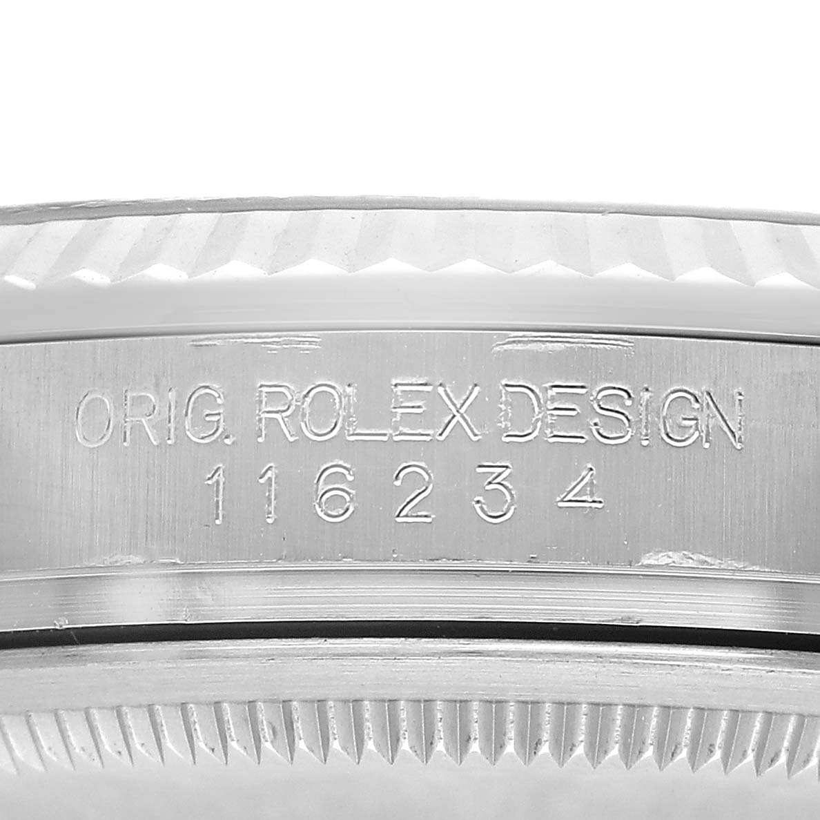 The image shows a close-up of the model number engraving on the case of a Rolex Datejust 116234 Men's Stainless Steel Black Dial watch, highlighting the bezel's edge.