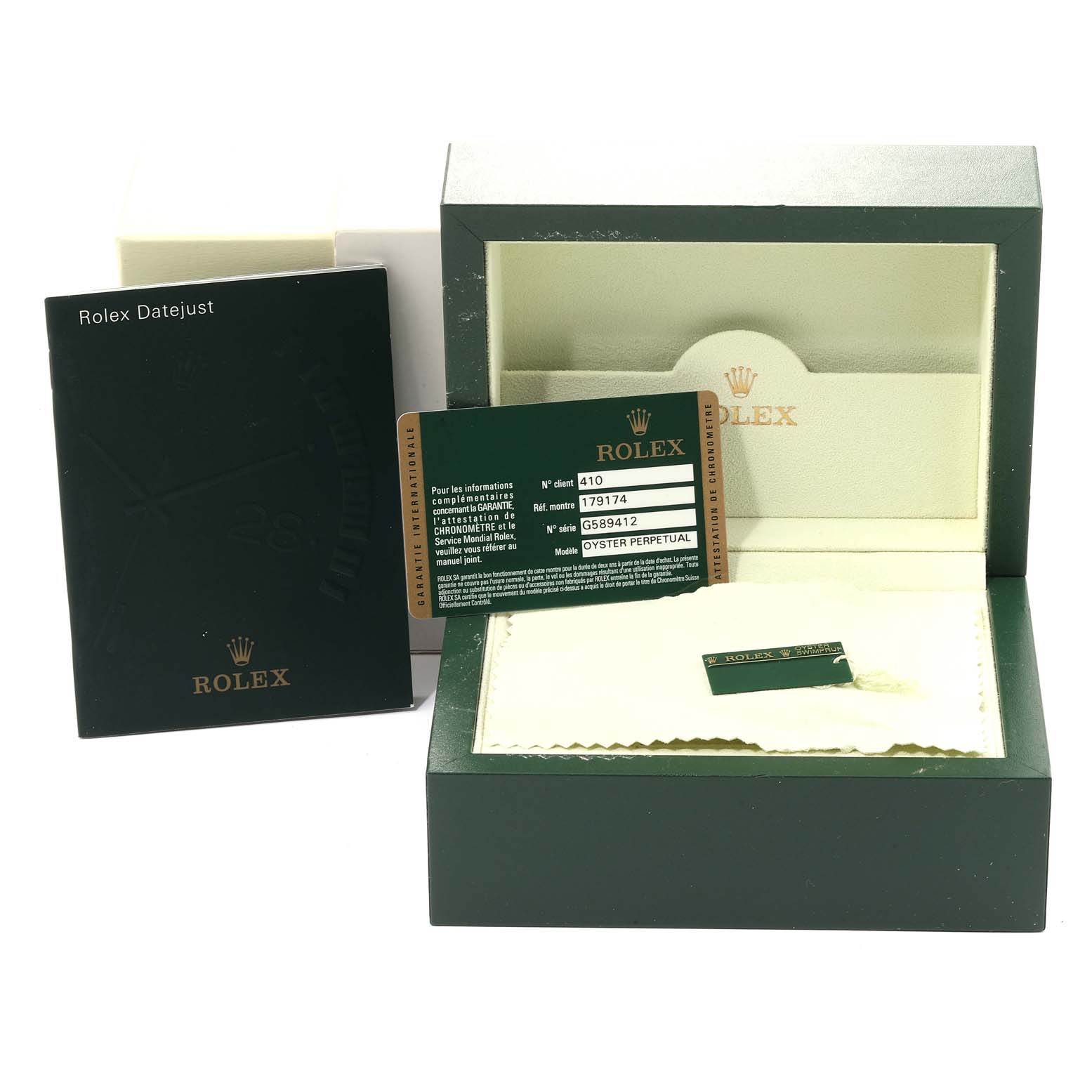 This image shows accessories for a Rolex Datejust 179174 Women
s Stainless Steel Silver Dial 179174 Women
s Stainless Steel Silver Dial, including the box, warranty card, and booklet.