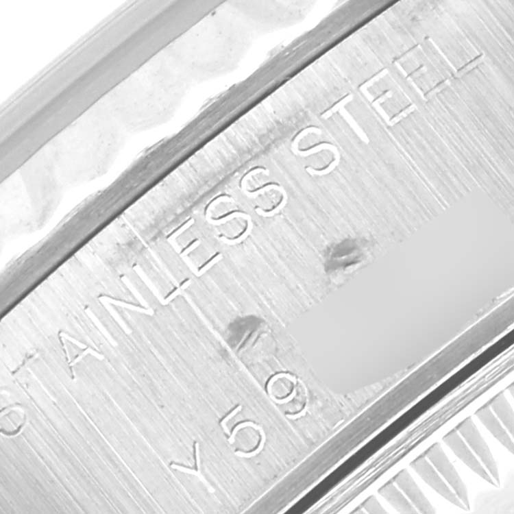 Close-up of the side of a Rolex Datejust 79174 Women
s Stainless Steel Mother of Pearl Dial 79174 Women
s Stainless Steel Mother of Pearl Dial watch showing "STAINLESS STEEL" engraved on the case.