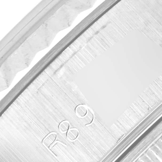 This is a close-up of the Rolex Datejust 69174 Women
s Stainless Steel Silver Dial 69174 Women
s Stainless Steel Silver Dial model
s inner bezel with engraved markings.