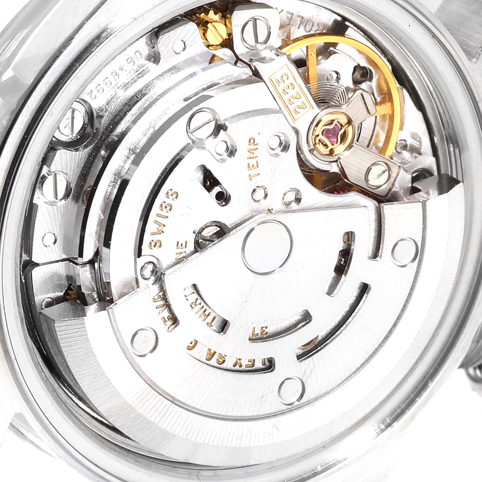 The image shows the intricate inner movement mechanism of a Rolex Datejust 79174 Women
s Stainless Steel Silver Dial 79174 Women
s Stainless Steel Silver Dial watch at a close-up angle.