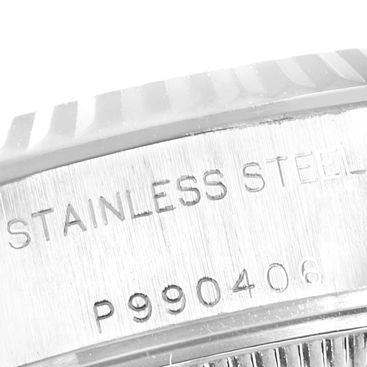 This image shows a close-up of the stainless steel case side of a Rolex Datejust 79174 Women
s Stainless Steel Silver Dial 79174 Women
s Stainless Steel Silver Dial watch, featuring part of the serial number.