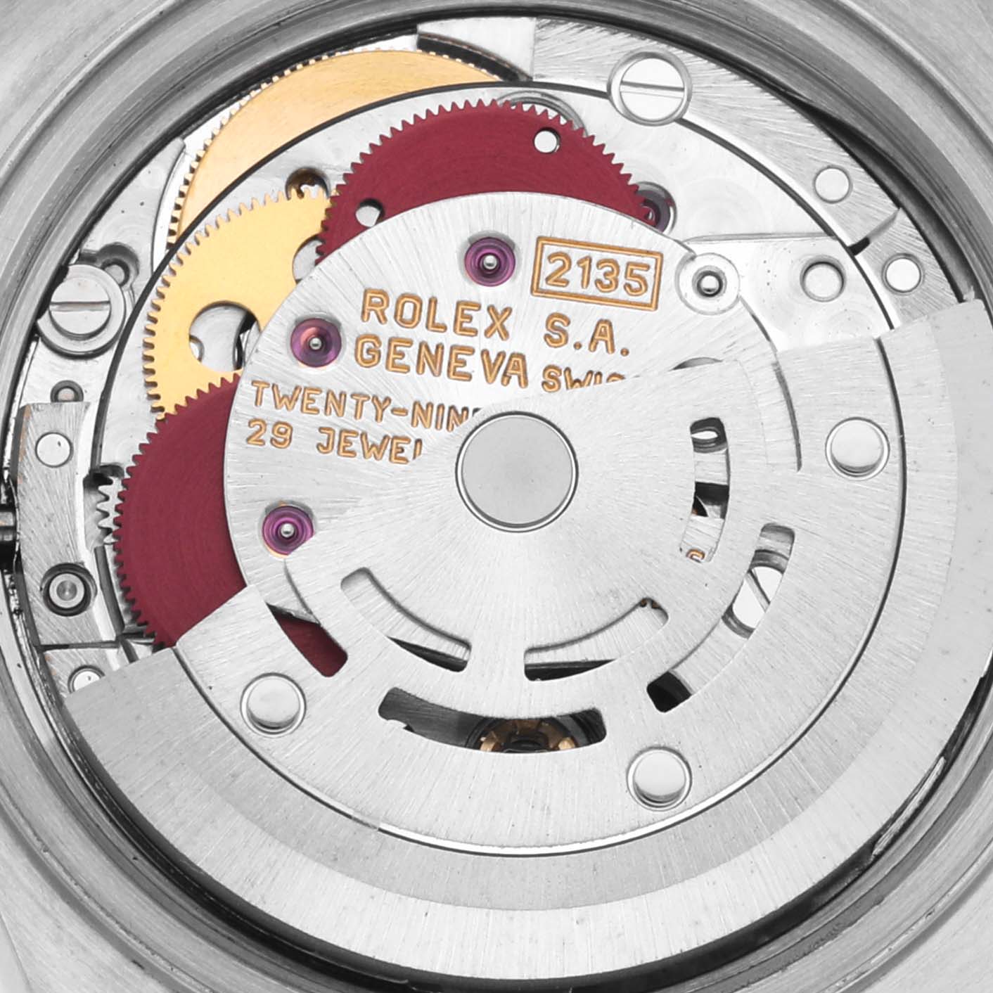 The image shows the internal mechanism of a Rolex Datejust 69173 Women's Steel and Gold (two tone) Silver Dial 69173 Women's Steel and Gold (two tone) Silver Dial watch, including gears, jewels, and the movement engraved with the brand and model details.