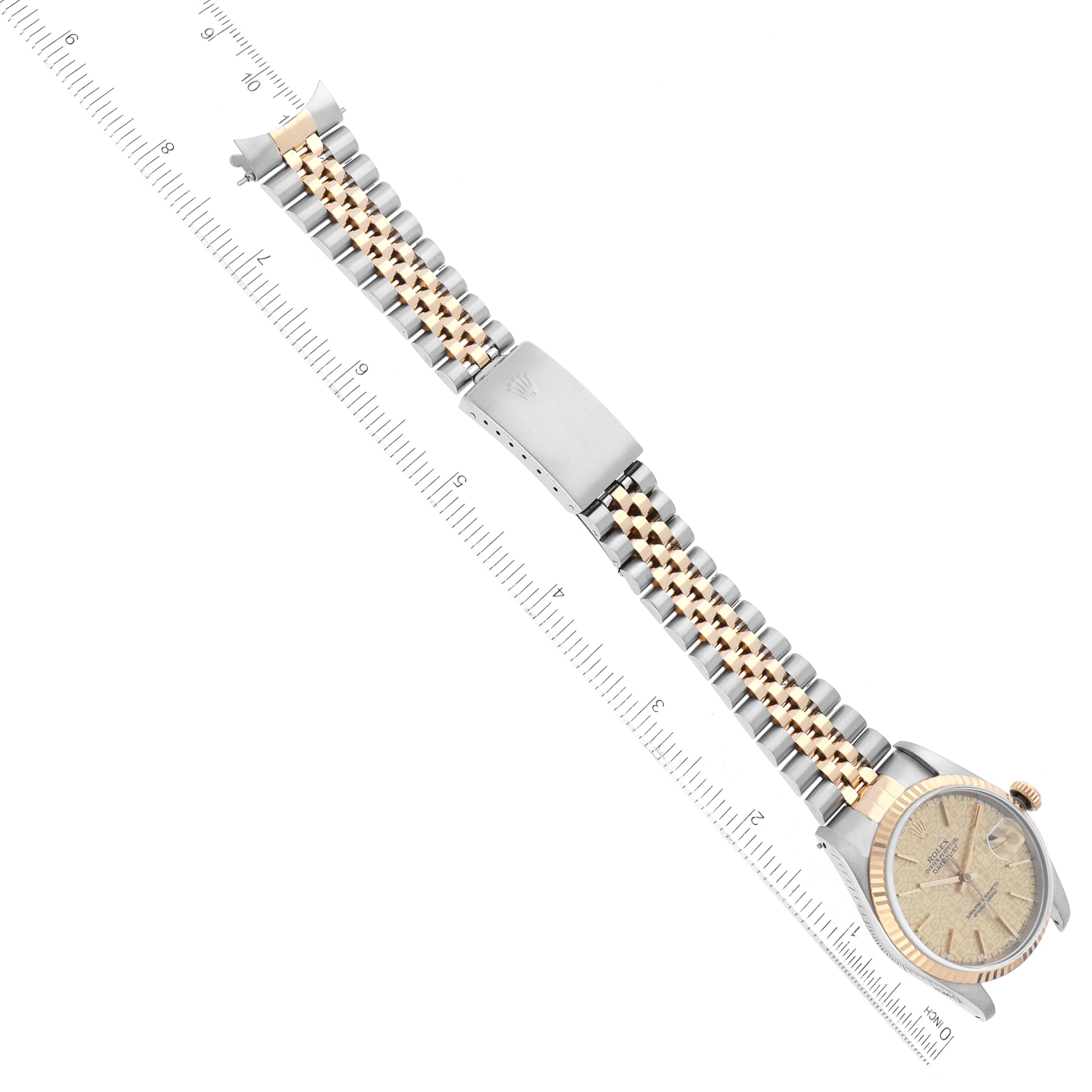 The image shows a Rolex Datejust 16233 Men
s Steel and Gold (two tone) Champagne Dial 16233 Men
s Steel and Gold (two tone) Champagne Dial watch laid flat with the face and the entire two-tone bracelet visible, measured against a ruler.