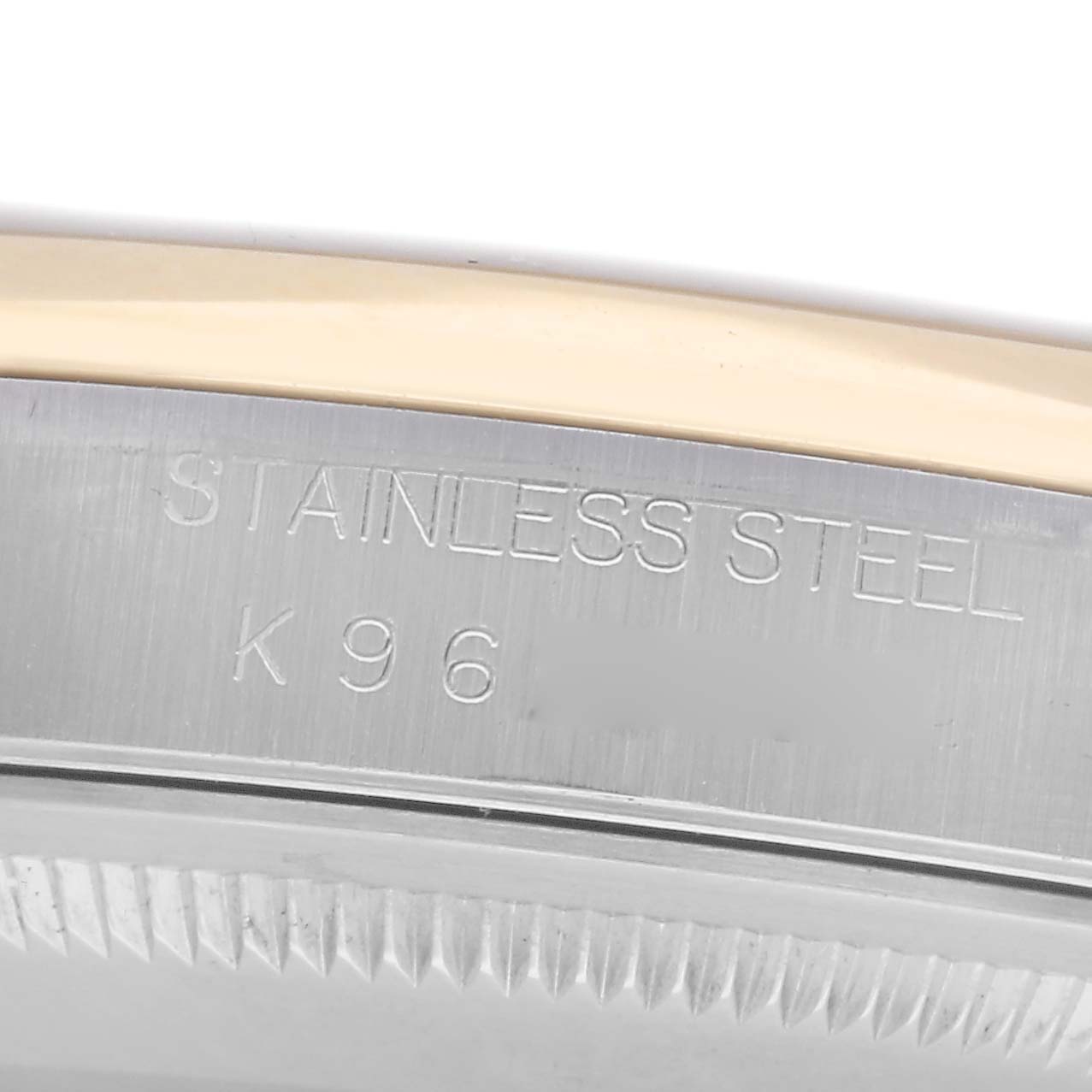The image shows a close-up of the side of the Rolex Datejust 16203 Men
s Steel and Gold (two tone) Champagne Dial 16203 Men
s Steel and Gold (two tone) Champagne Dial, focusing on the stainless steel case engravings.