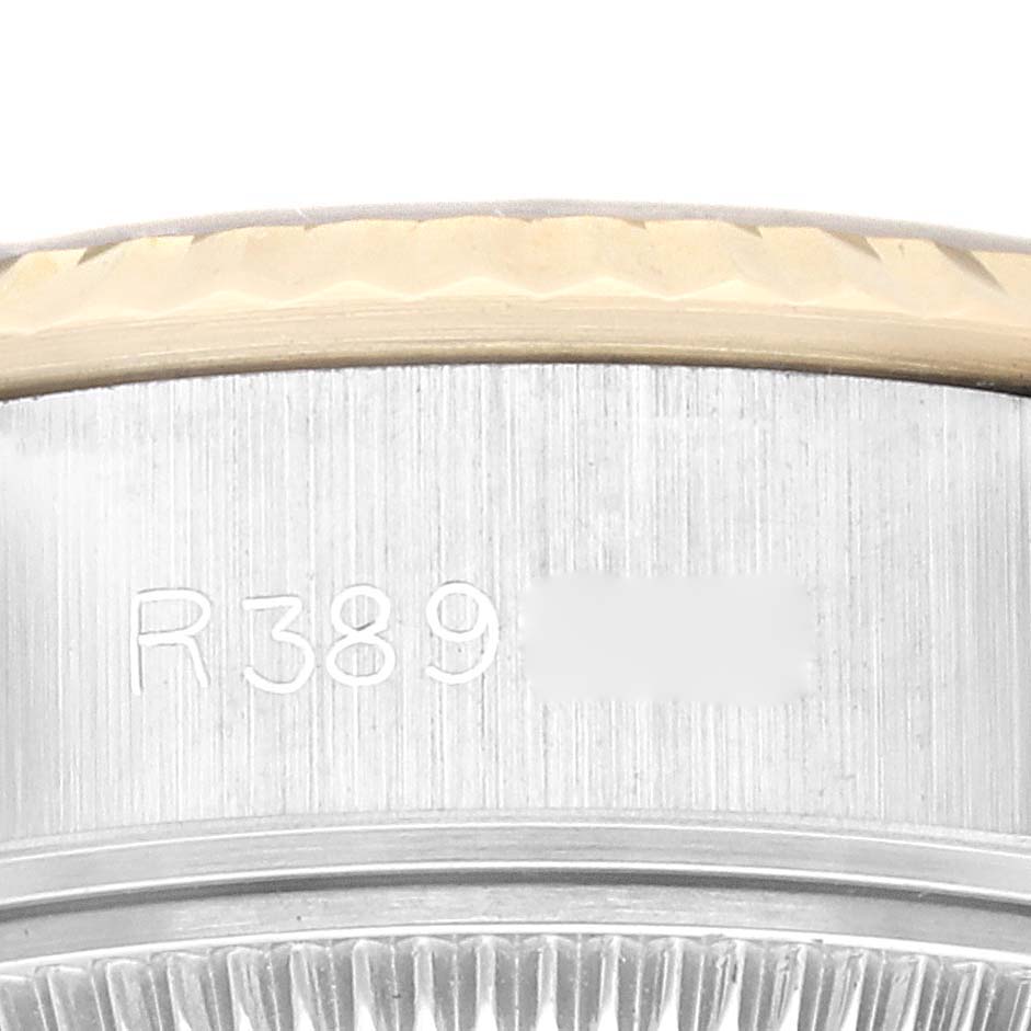 This close-up image of a Rolex Datejust 69173G Women's Steel and Gold (two tone) Champagne Dial 69173G Women's Steel and Gold (two tone) Champagne Dial watch shows the side of the case with the model number engraved.