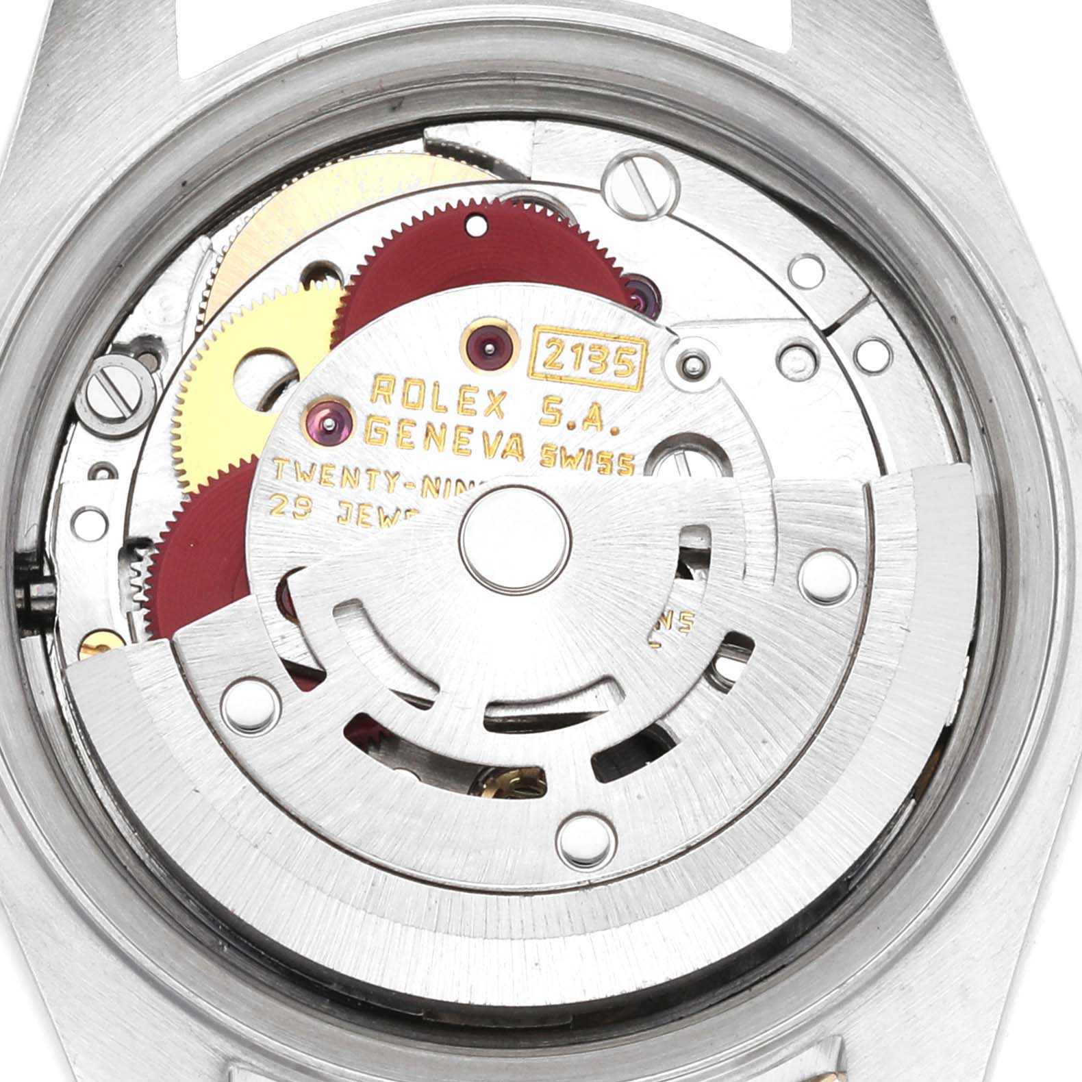 This is an internal close-up view of the Rolex Datejust 69173G Women's Steel and Gold (two tone) Champagne Dial 69173G Women's Steel and Gold (two tone) Champagne Dial watch movement, showcasing gears and the rotor.