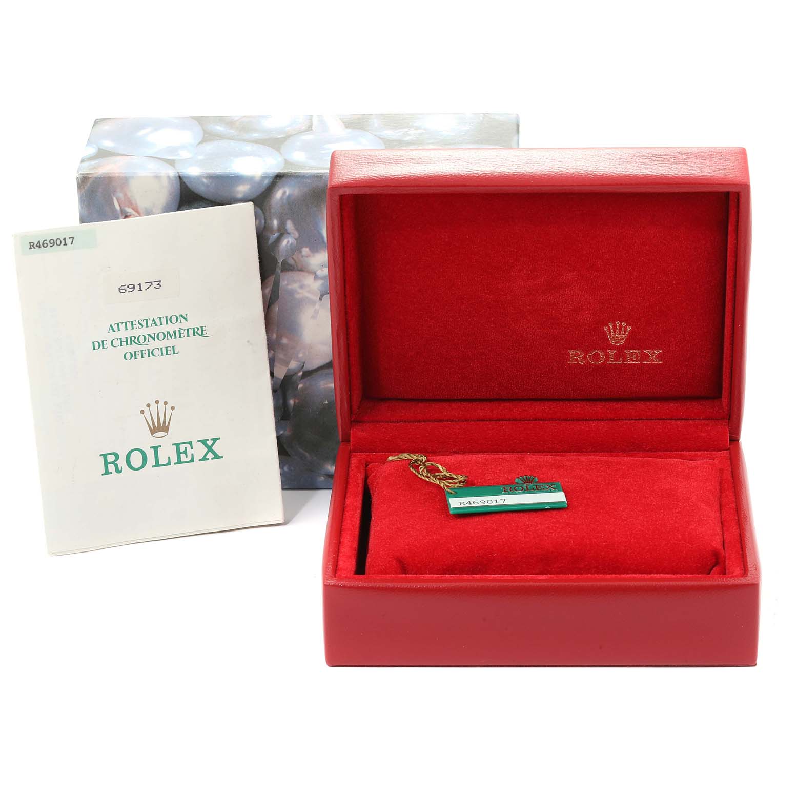 The image shows a Rolex Datejust 69173 Women
s Steel and Gold (two tone) Champagne Dial 69173 Women
s Steel and Gold (two tone) Champagne Dial box, an official chronometer certificate, and a hang tag, at an angled view.