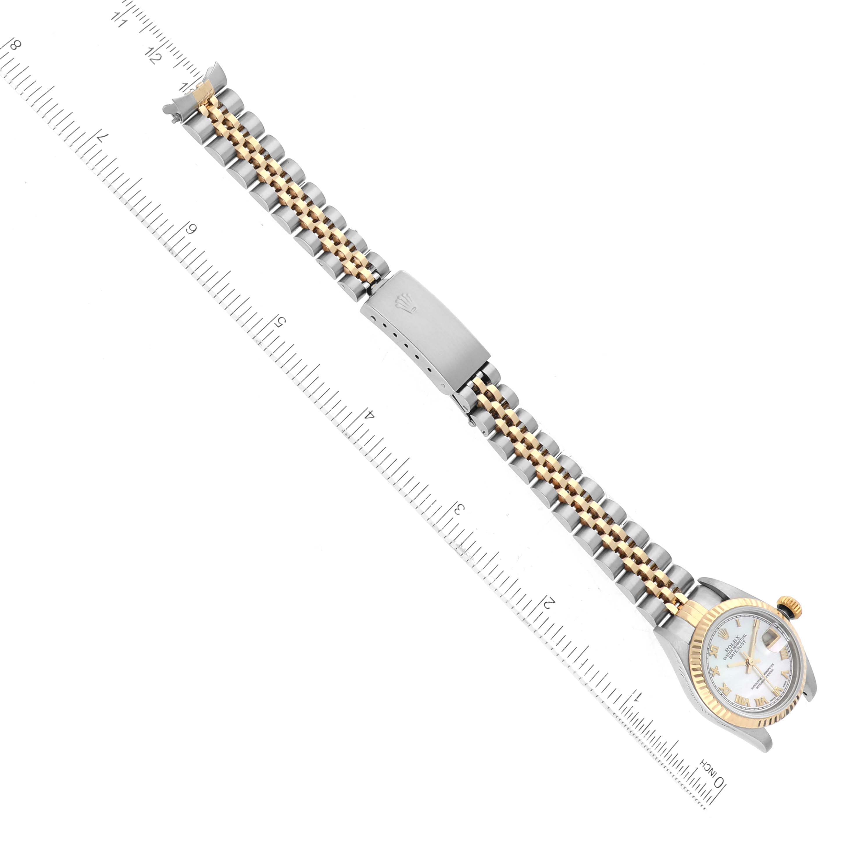 The Rolex Datejust 79173 Women
s Steel and Gold (two tone) Mother of Pearl Dial 79173 Women
s Steel and Gold (two tone) Mother of Pearl Dial watch is shown from a top-down angle, including the bracelet, clasp, and part of the dial.