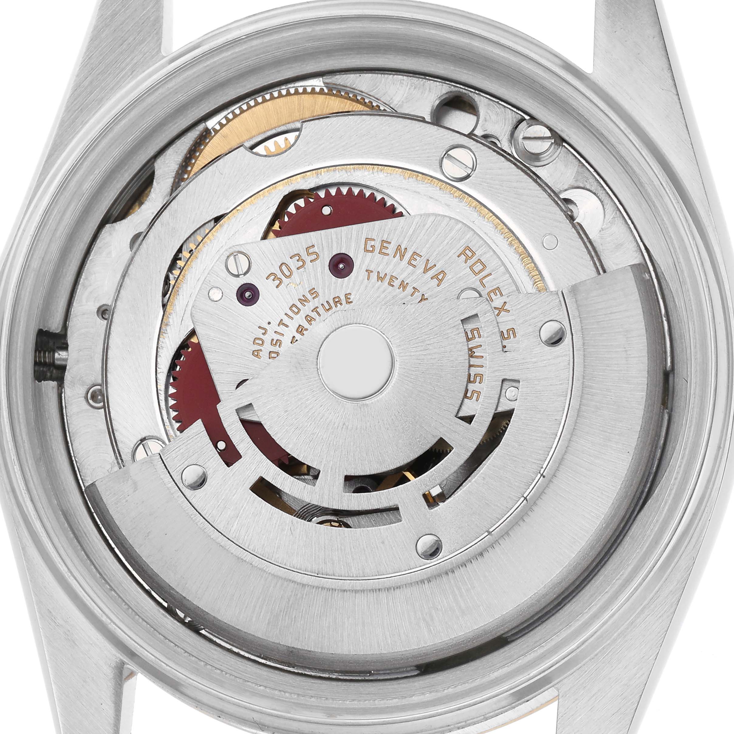 The image shows the back view of a Rolex Datejust 16013 Men
s Steel and Gold (two tone) Champagne Dial 16013 Men
s Steel and Gold (two tone) Champagne Dial watch, revealing its internal mechanism and rotor.