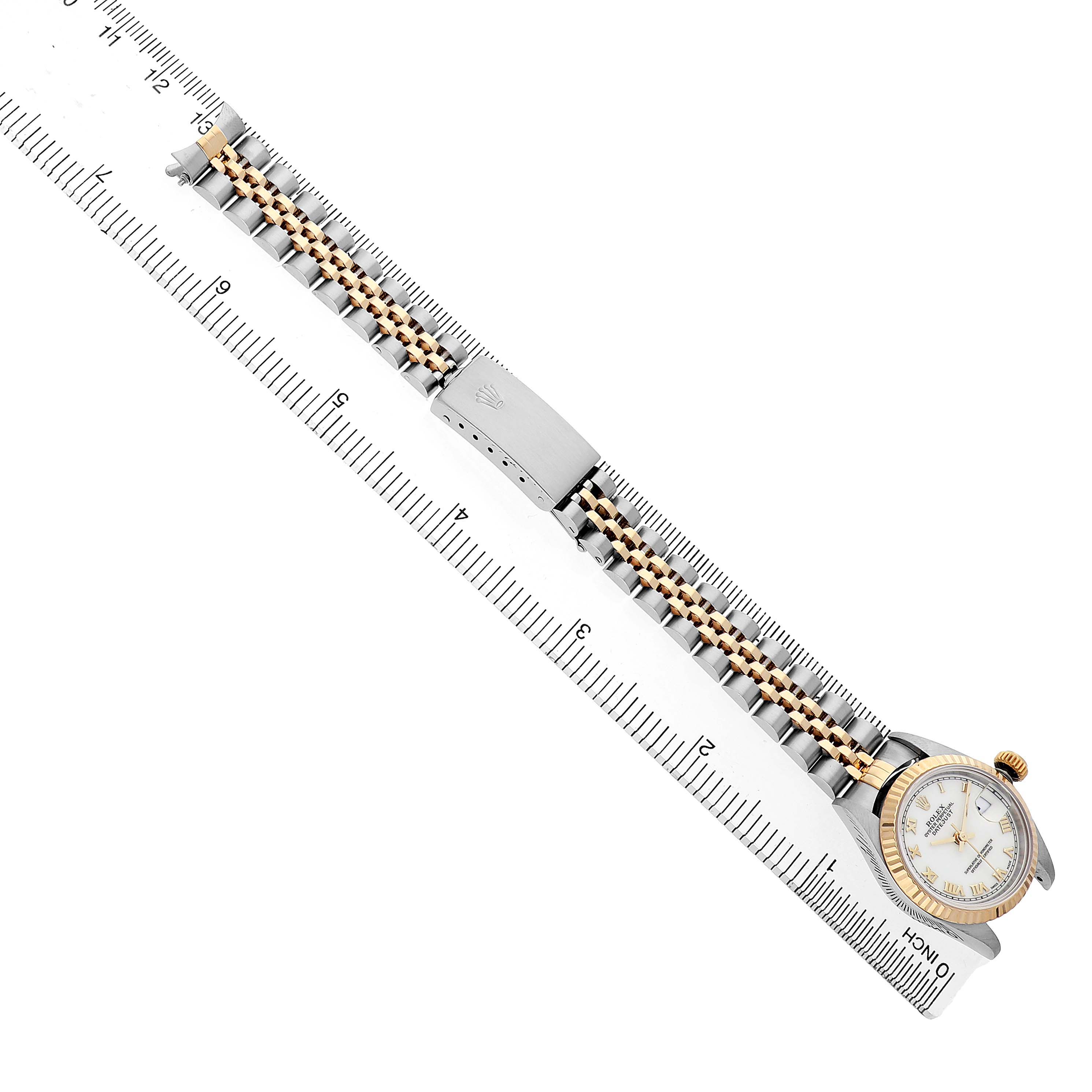 The Rolex Datejust 69173 Women's Steel and Gold (two tone) White Dial watch is shown horizontally with a clear view of its face, bracelet, and clasp, alongside a measuring ruler.