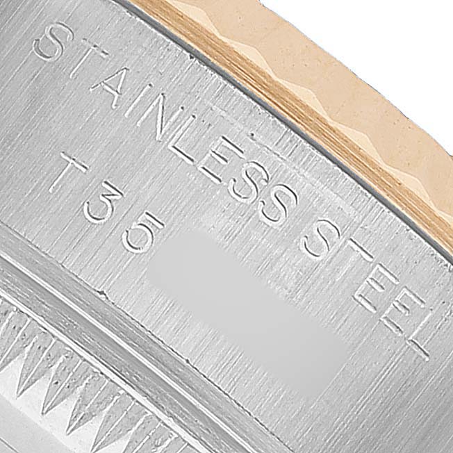 The image shows the side engraving of the Rolex Datejust 69173 Women's Steel and Gold (two tone) White Dial case, highlighting "STAINLESS STEEL."