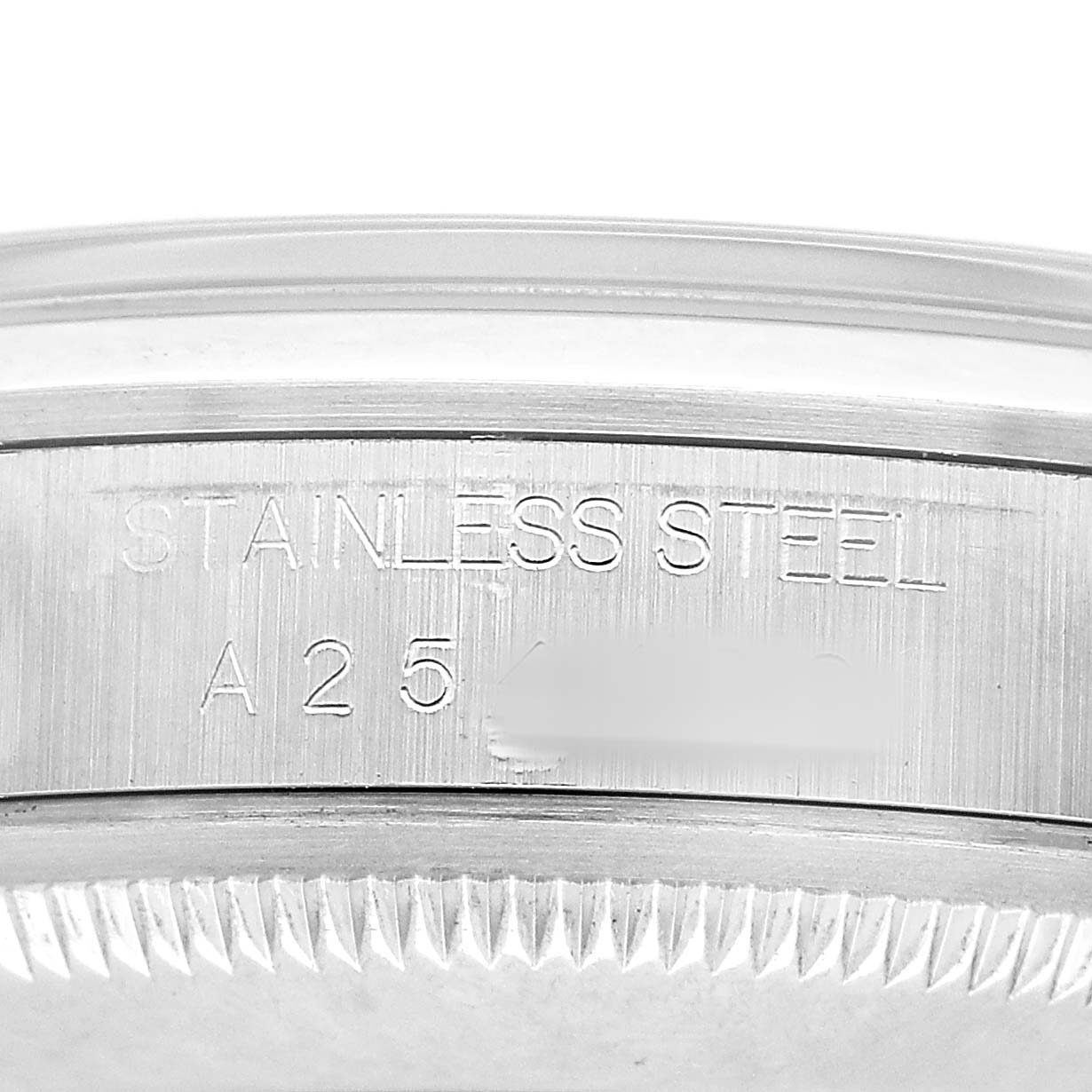 The image shows a close-up of the engraved side of a stainless steel Rolex Explorer 14270 Men's Stainless Steel Black Dial watch, focusing on the edge and serial number.