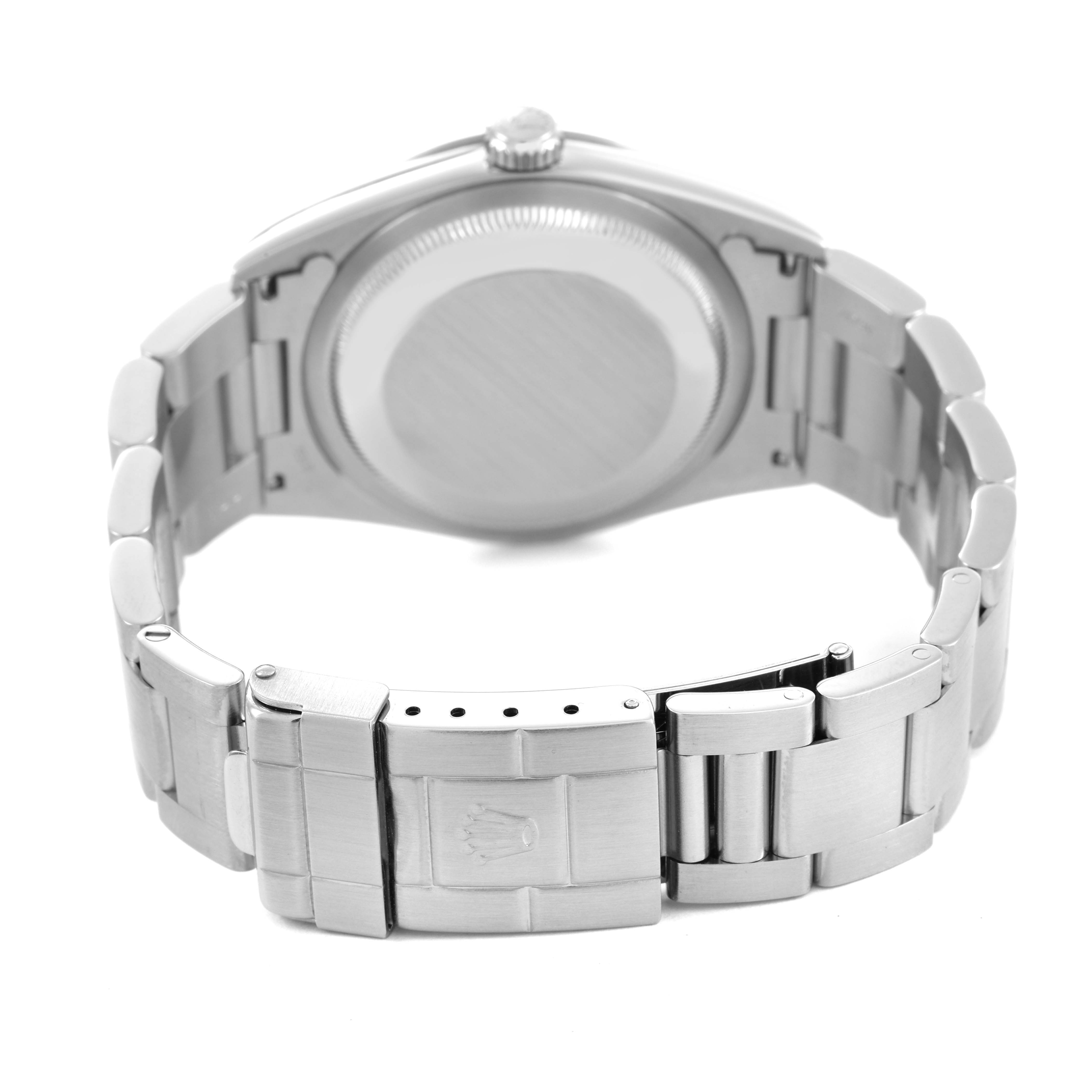 The image shows the back of a Rolex Explorer 14270 Men's Stainless Steel Black Dial watch, highlighting the case back and clasp on the bracelet.