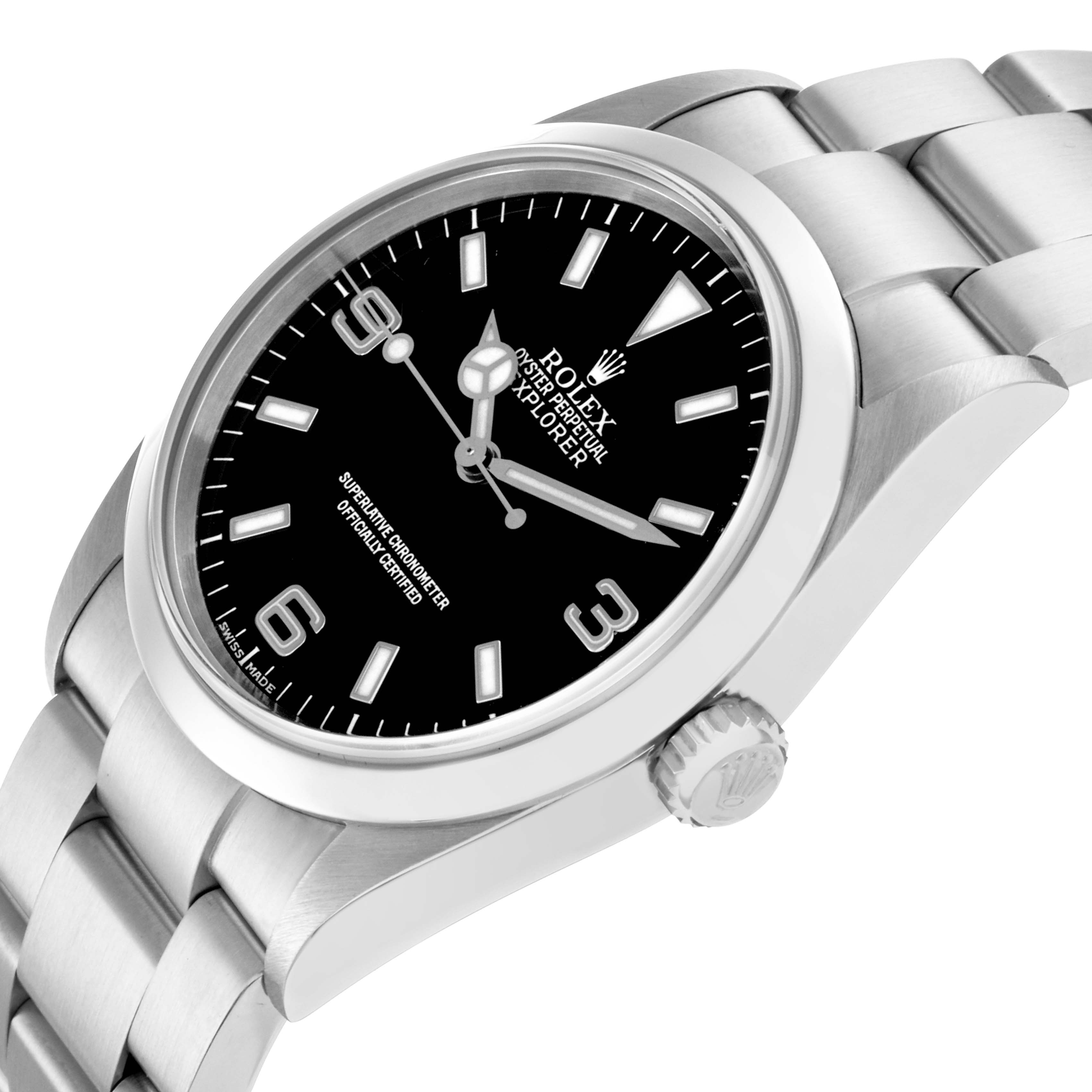 The Rolex Explorer 114270 Men's Stainless Steel Black Dial 114270 Men's Stainless Steel Black Dial watch is shown at a tilted angle, displaying the face, bezel, crown, and part of the bracelet.