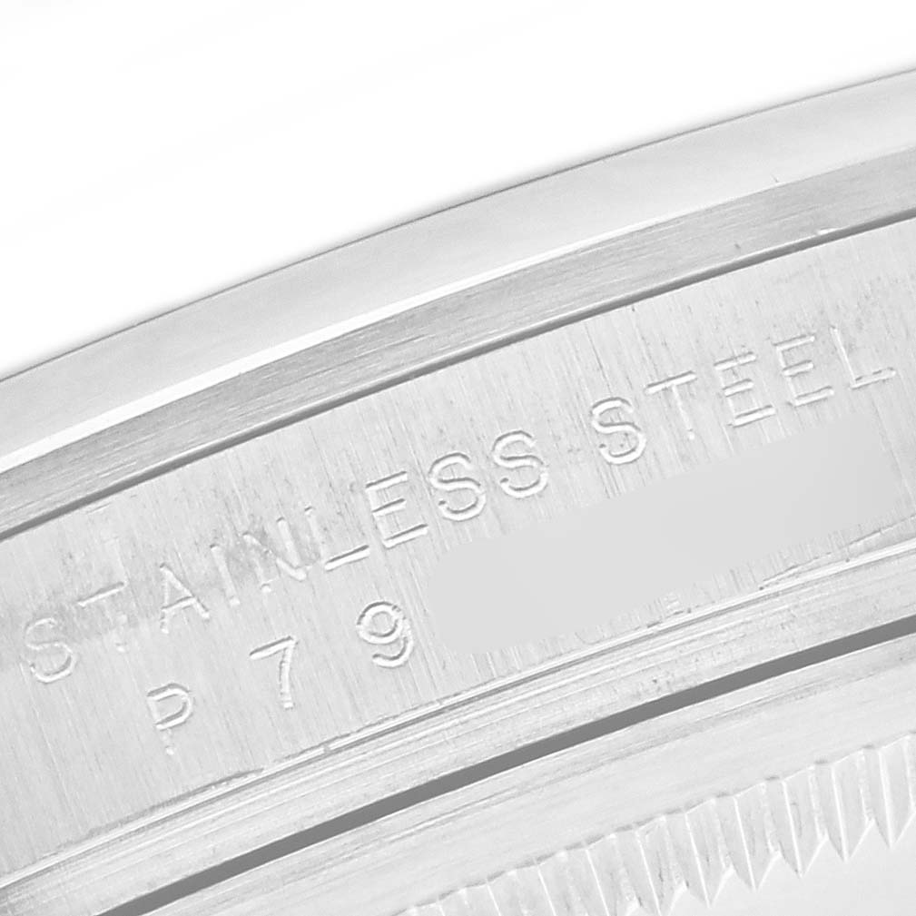 The image shows a close-up of the stainless steel case back with engraving on the Rolex Explorer 114270 Men's Stainless Steel Black Dial 114270 Men's Stainless Steel Black Dial watch.