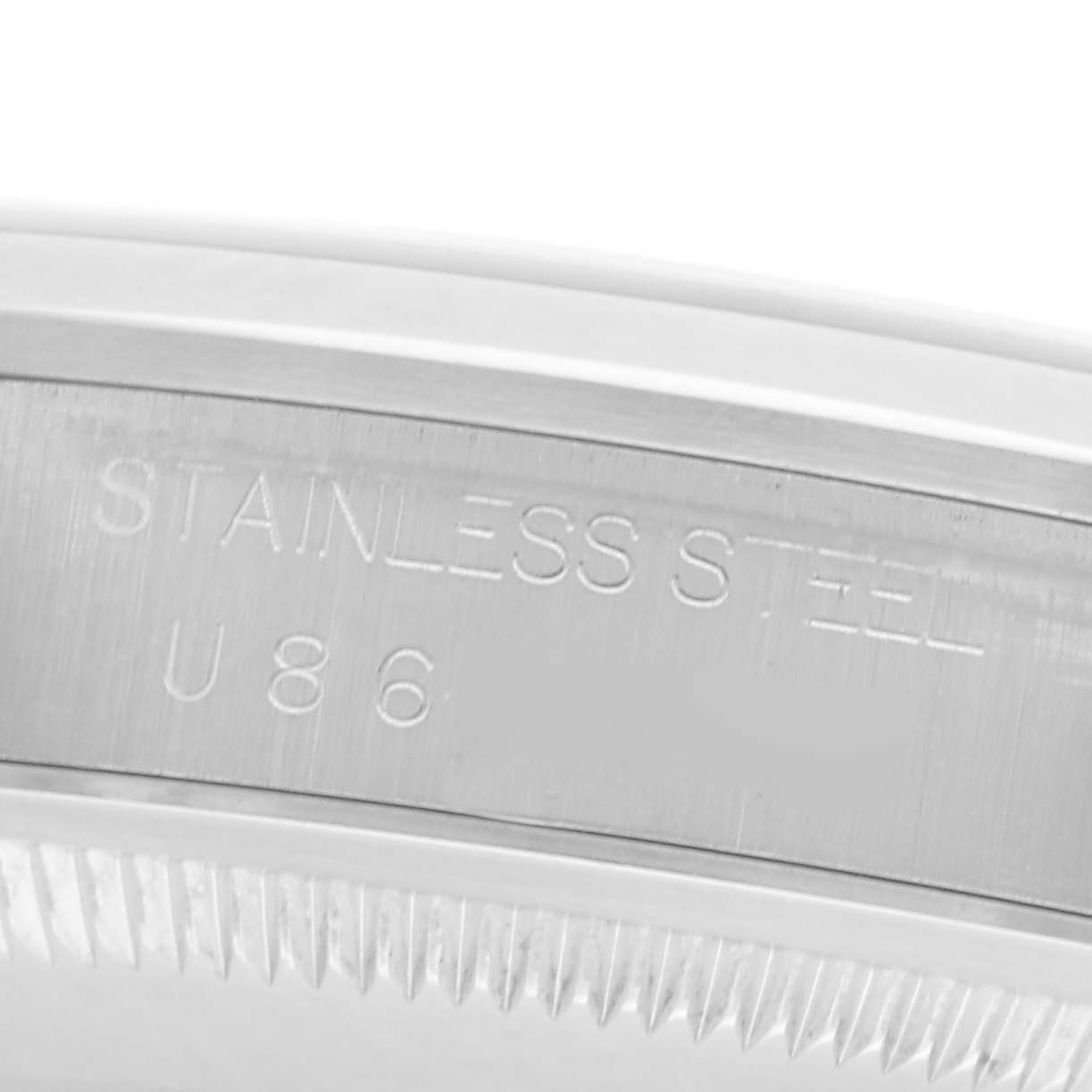 The image shows a close-up of the edge and inner engraving on the Rolex Explorer 14270 Men
s Stainless Steel Black Dial 14270 Men
s Stainless Steel Black Dial
s stainless steel casing.