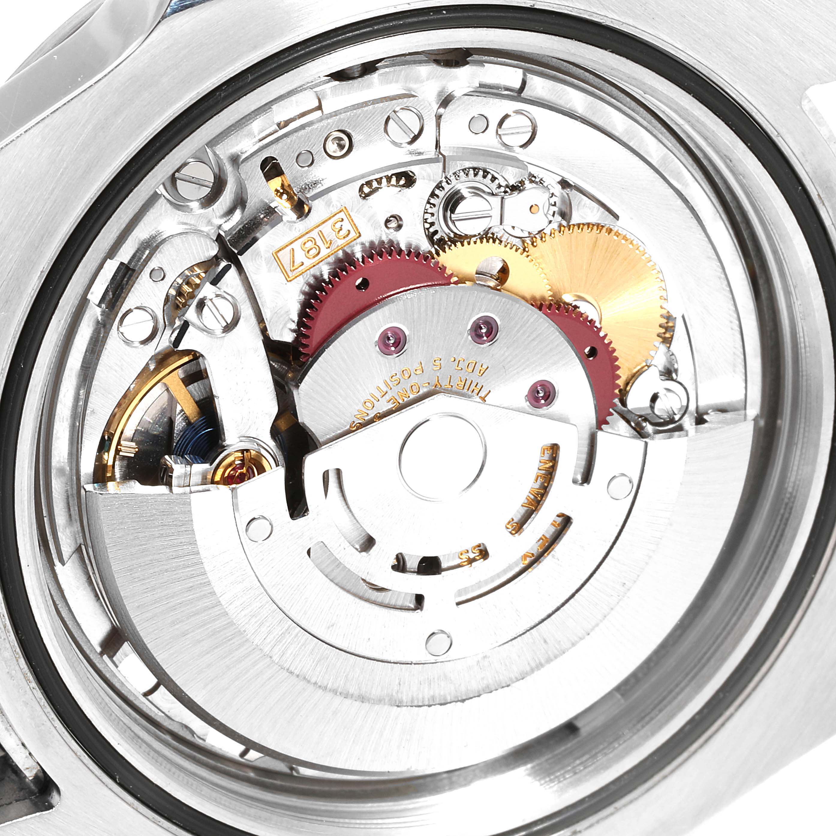 The image shows the inner mechanical movement of the Rolex Explorer 216570 Men's Stainless Steel White Dial 216570 Men's Stainless Steel White Dial watch from a close-up angle, highlighting gears and components.