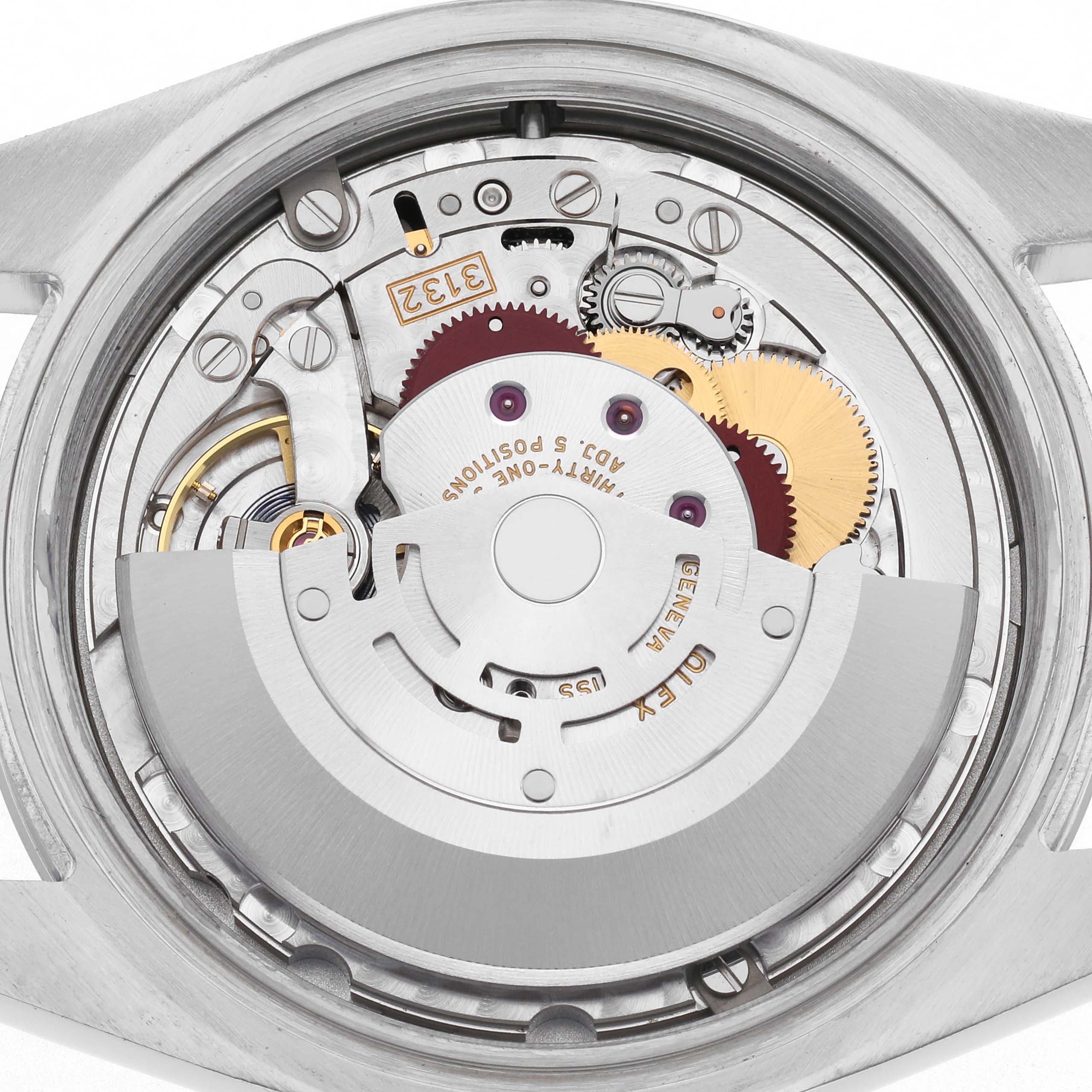 The image shows the movement from the back of a Rolex Oyster Perpetual 114300 Men
s Stainless Steel Black Dial 114300 Men
s Stainless Steel Black Dial, displaying gears and components.