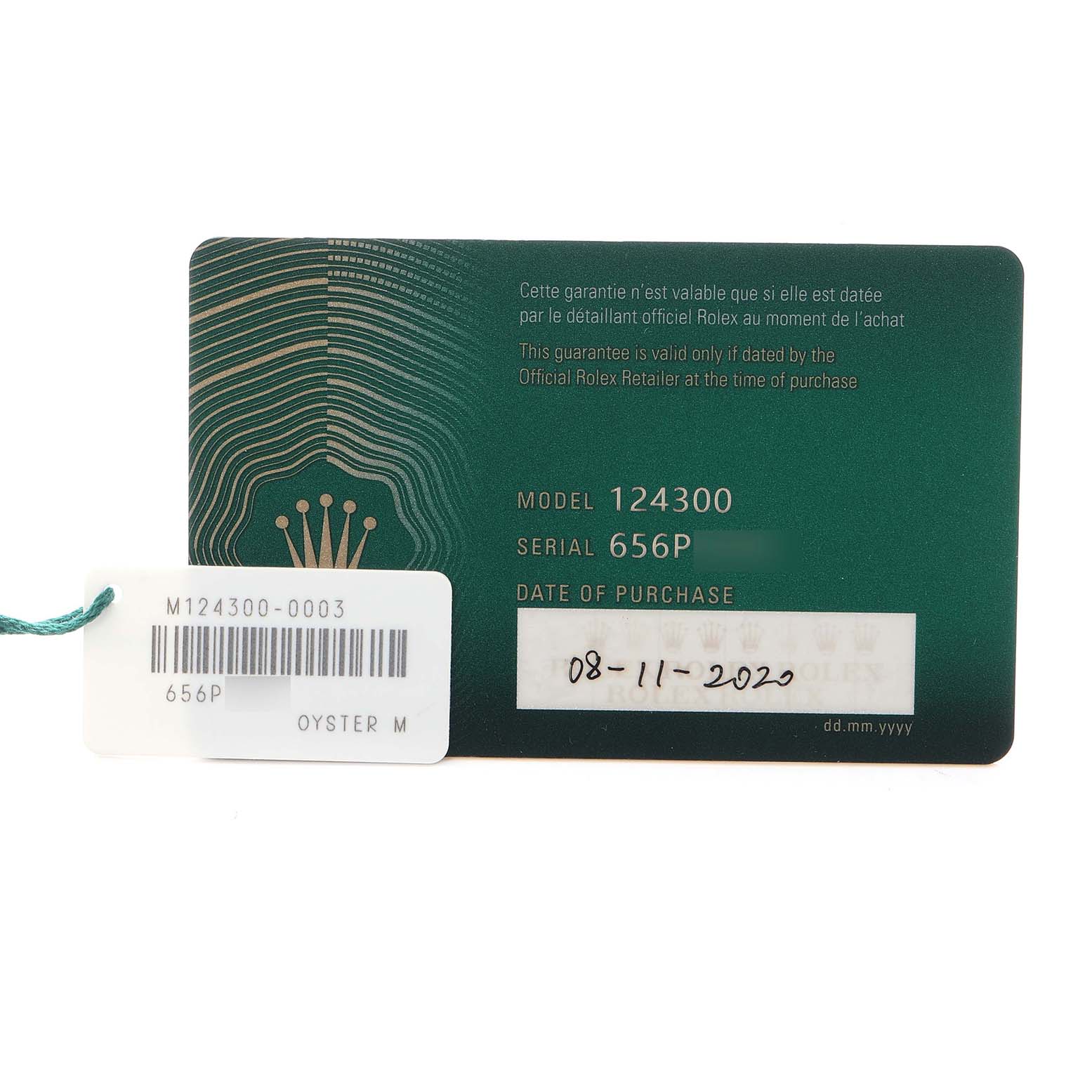 The image shows a warranty card for a Rolex Oyster Perpetual 124300 Men
s Stainless Steel Blue Dial 124300 Men
s Stainless Steel Blue Dial model 124300, featuring details like the serial number.