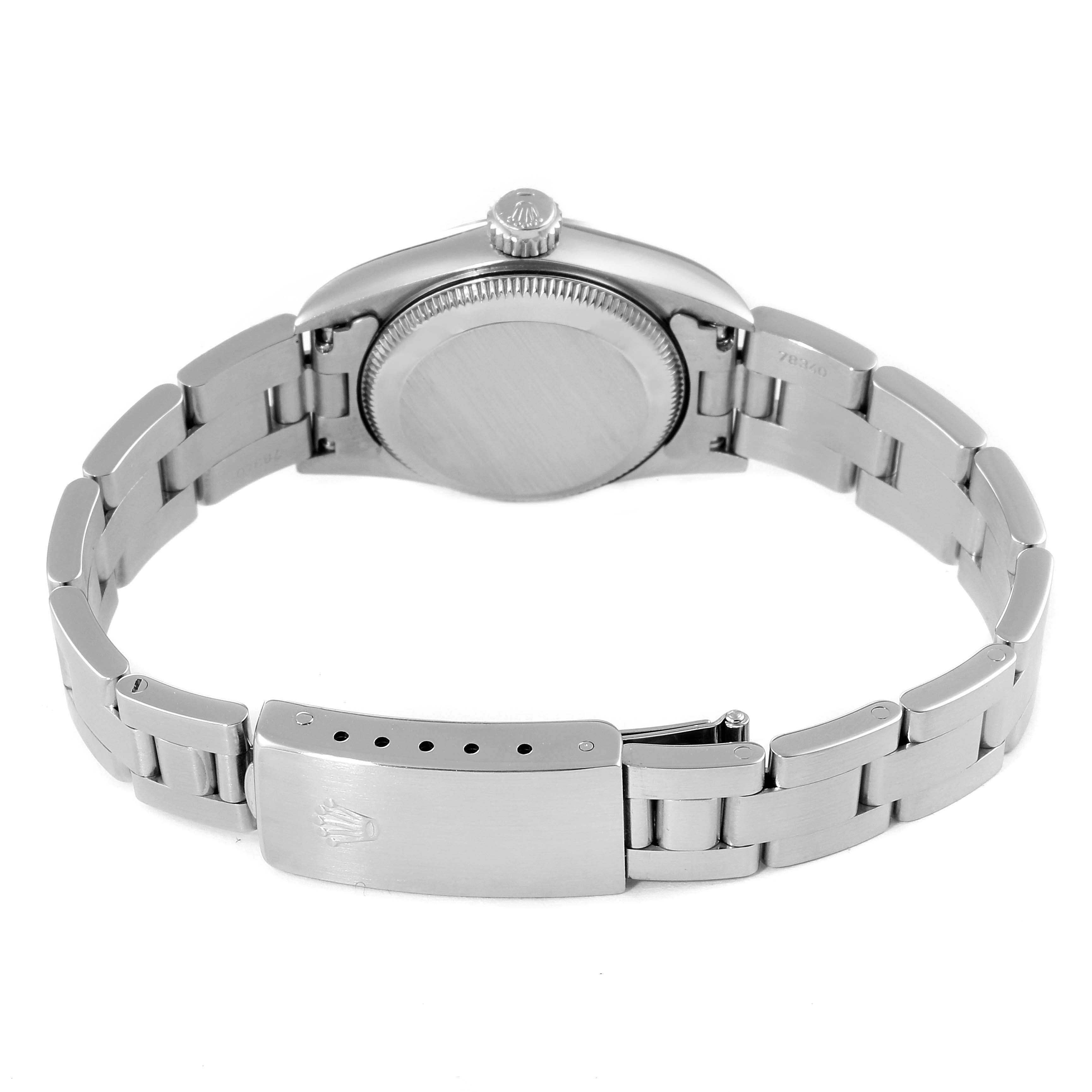 The image displays the back view of the Oyster Perpetual Rolex watch, focusing on its closed clasp and stainless steel bracelet.