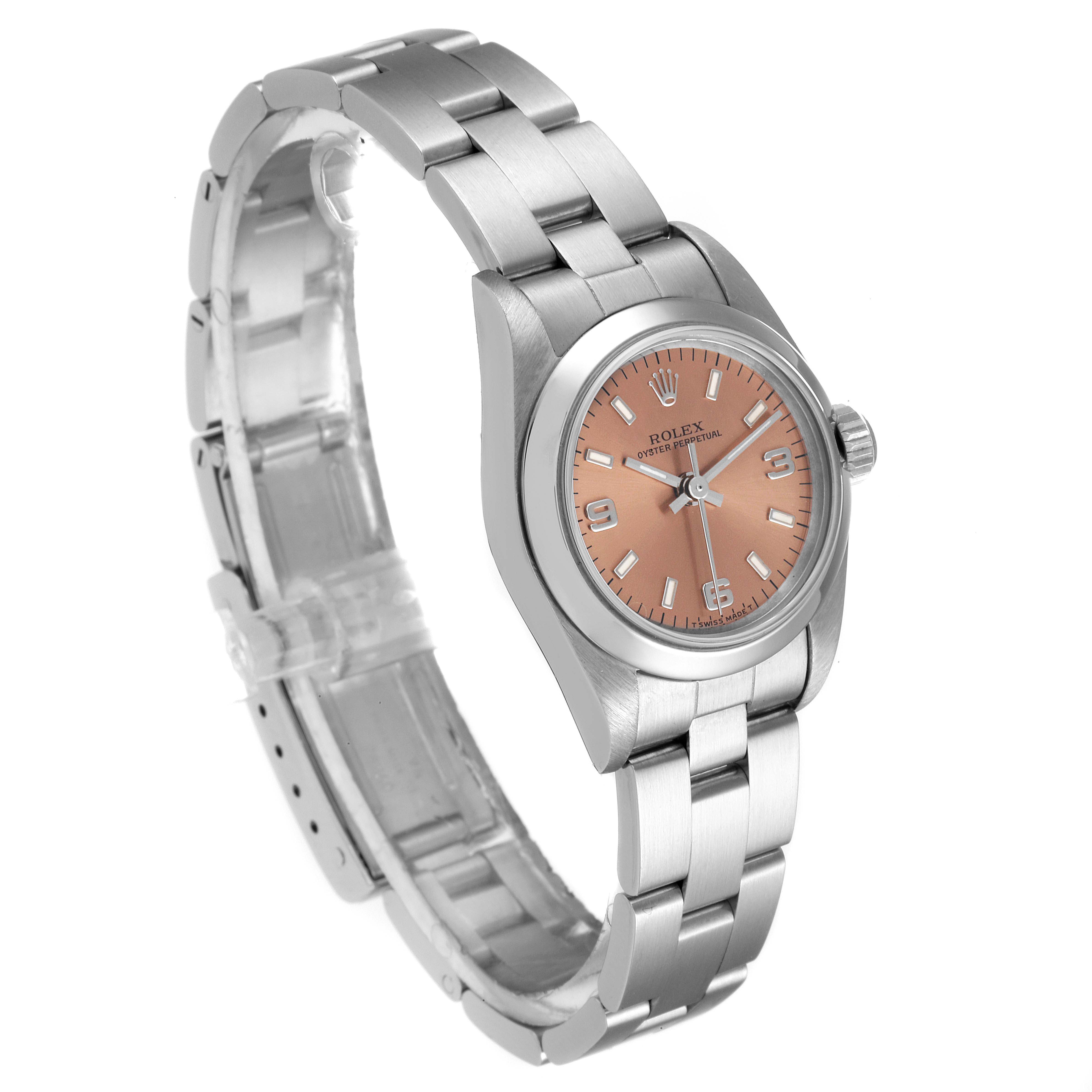 This image shows the Rolex Oyster Perpetual 67180 Women's Stainless Steel Pink Dial 67180 Women's Stainless Steel Pink Dial watch from a tilted angle, highlighting the face, bezel, and full bracelet.